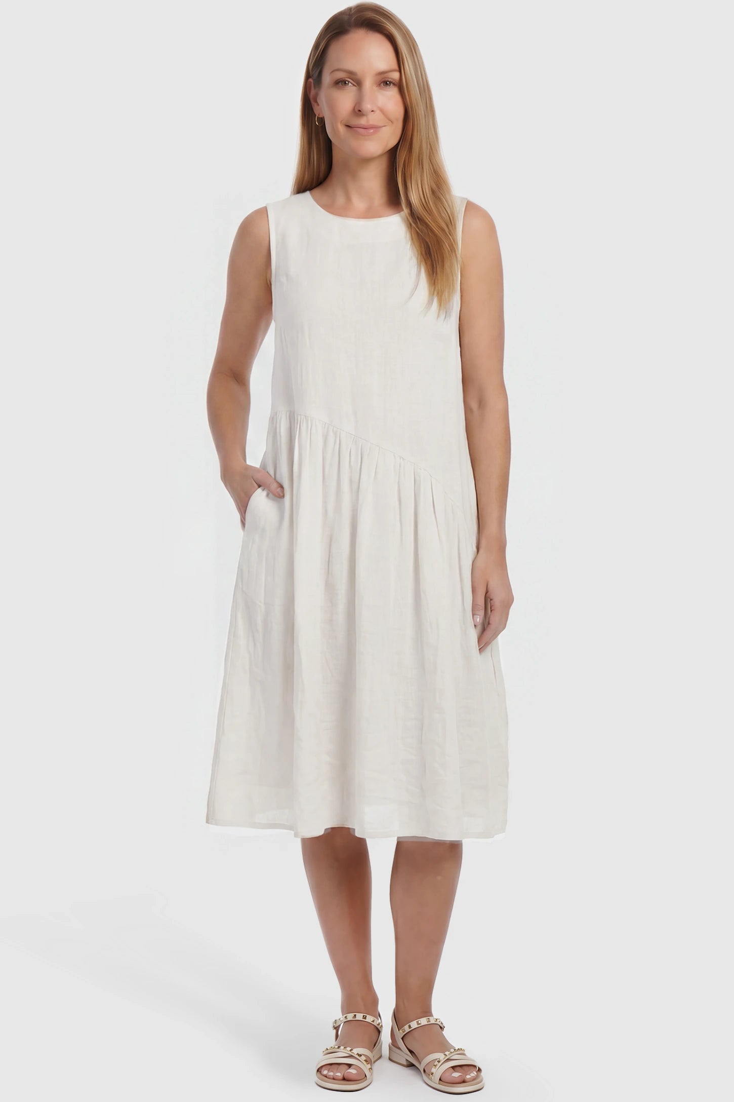 Sleeveless Pocketed A-Line Maternity Midi Dress Sleeveless pocketed A-line maternity midi dress in white with sleeveless cut, front view on postpartum model