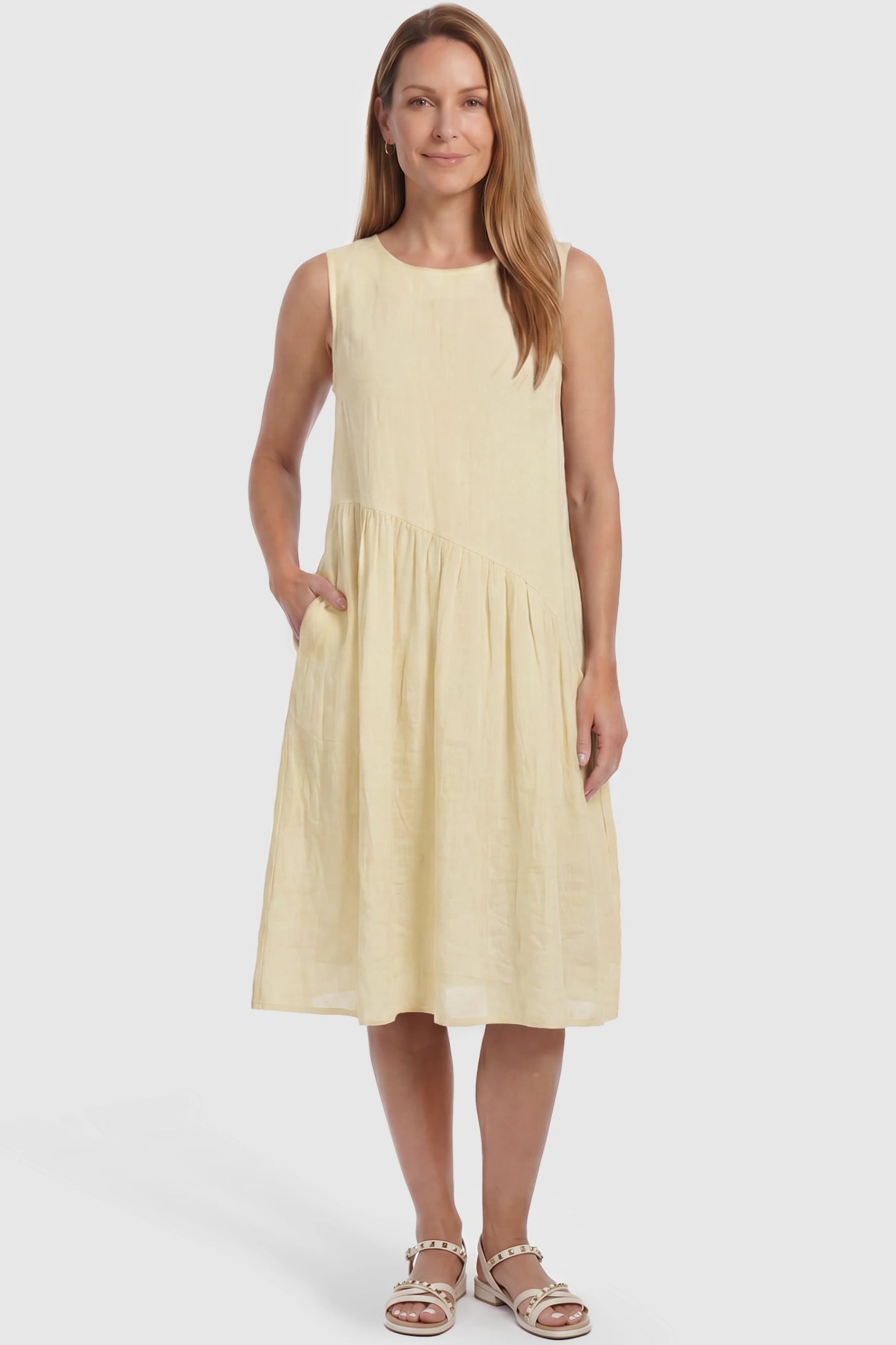 Sleeveless Pocketed A-Line Maternity Midi Dress Sleeveless pocketed A-line maternity midi dress in yellow with sleeveless cut, front view on postpartum model