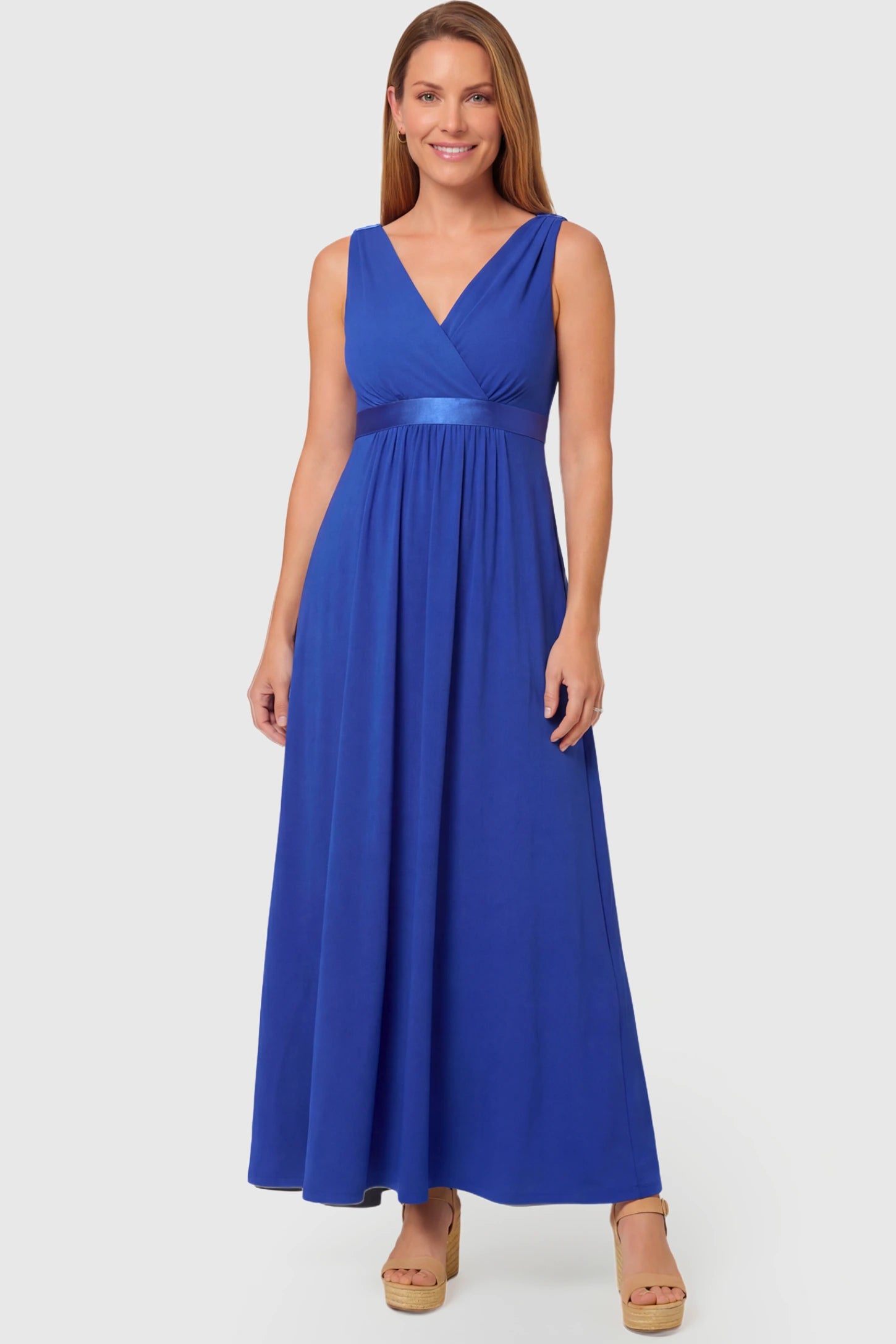 Sleeveless Faux Wrap Maternity & Nursing Maxi Dress Sleeveless Faux Wrap Maternity & Nursing Maxi Dress in royal blue featuring V-neckline and empire waist on a non pregnant model.