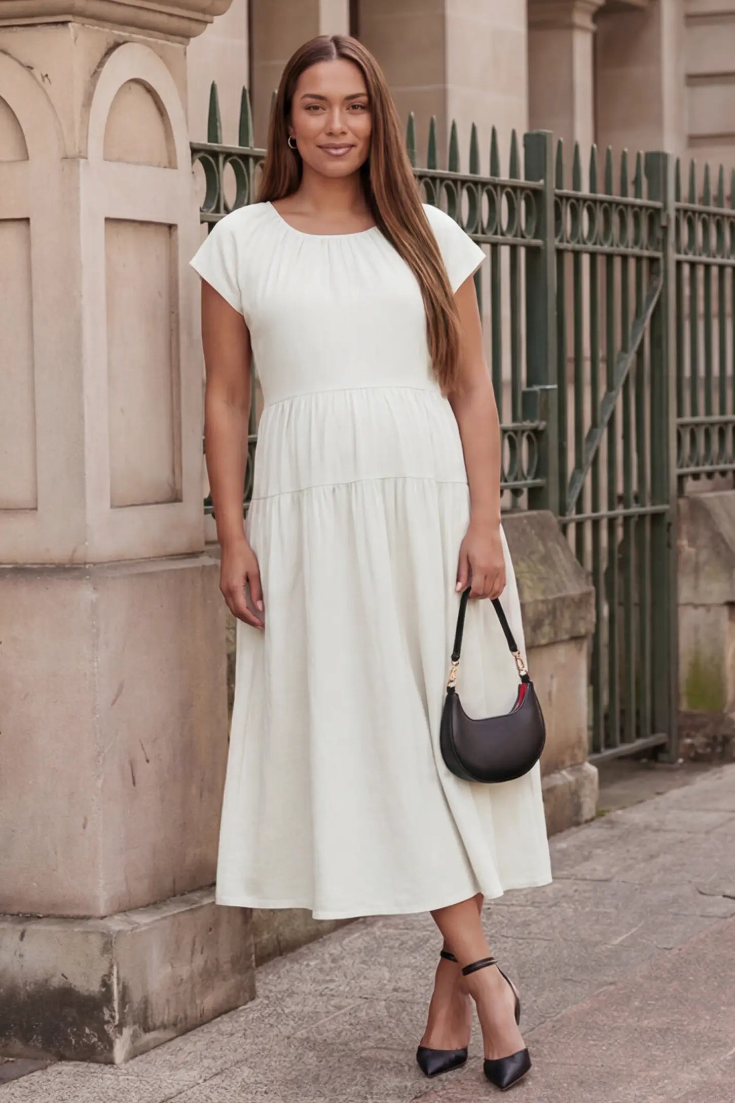Adjustable Waist-Tie A-Line Maternity Midi Dress Adjustable waist-tie A-line maternity midi dress in beige with short sleeves, front view on pregnant model