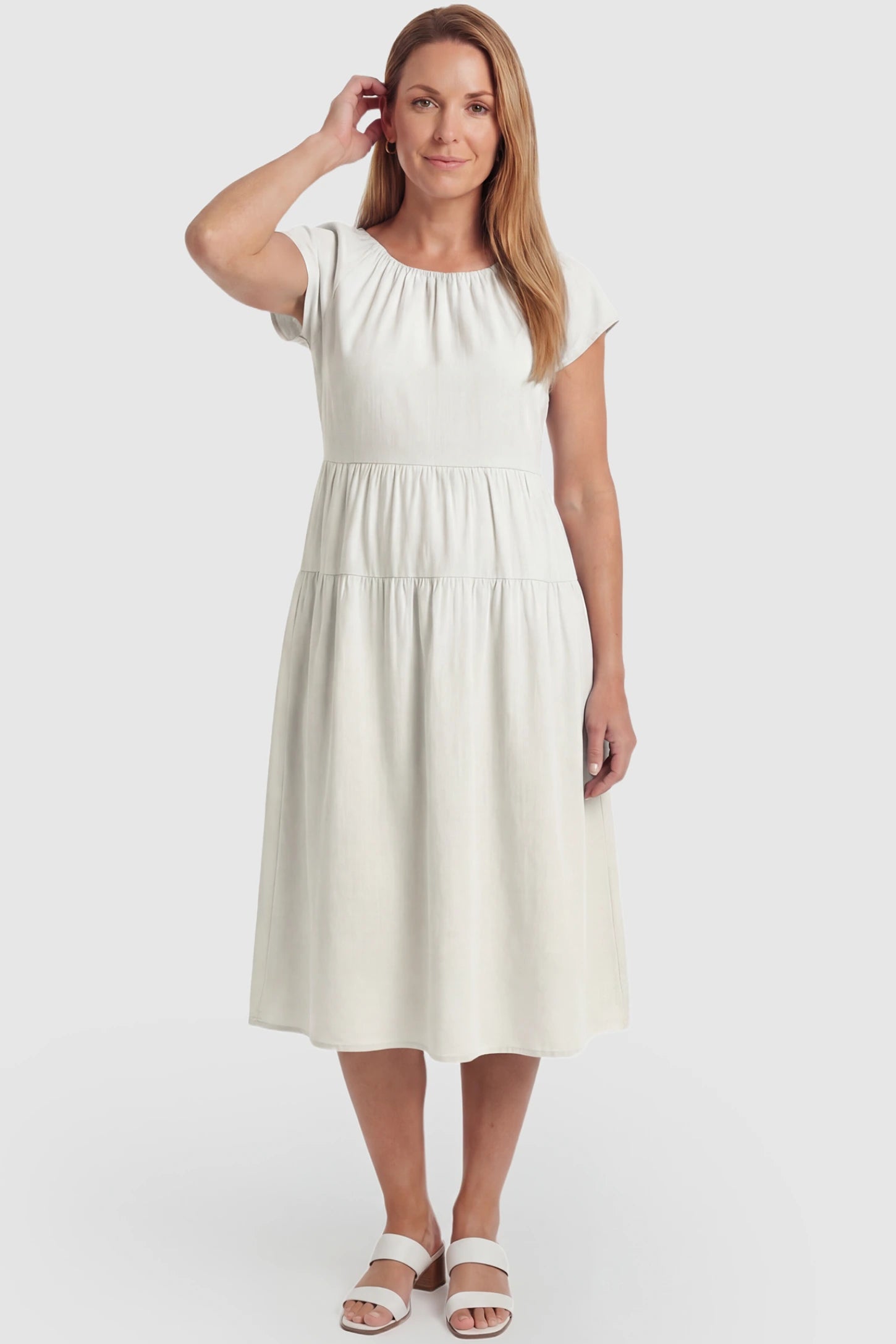 Adjustable Waist-Tie A-Line Maternity Midi Dress Adjustable waist-tie A-line maternity midi dress in beige with flowy A-line silhouette, front view on postpartum model