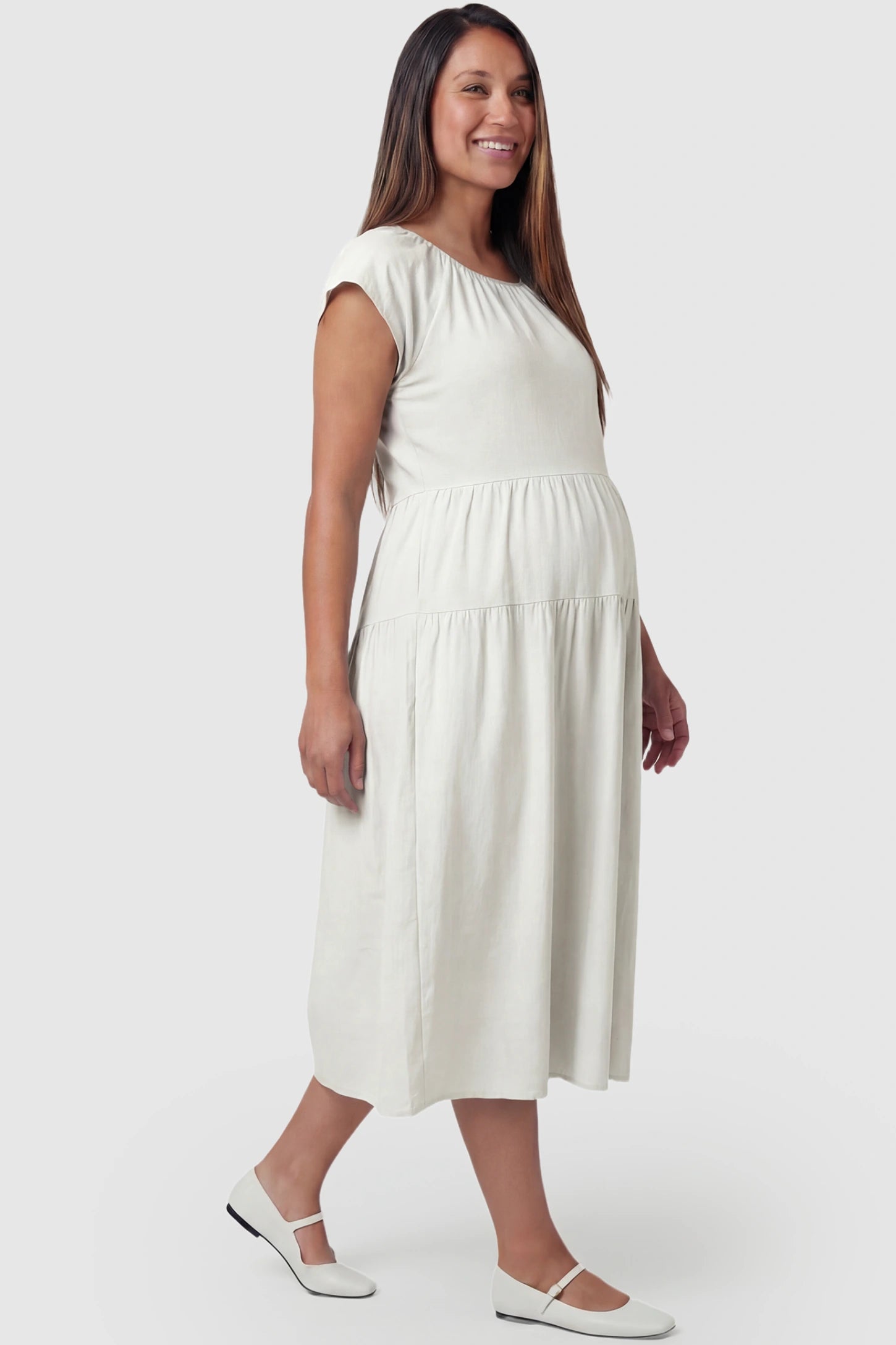 Adjustable Waist-Tie A-Line Maternity Midi Dress Adjustable waist-tie A-line maternity midi dress in blue with short sleeves, side view on pregnant model
