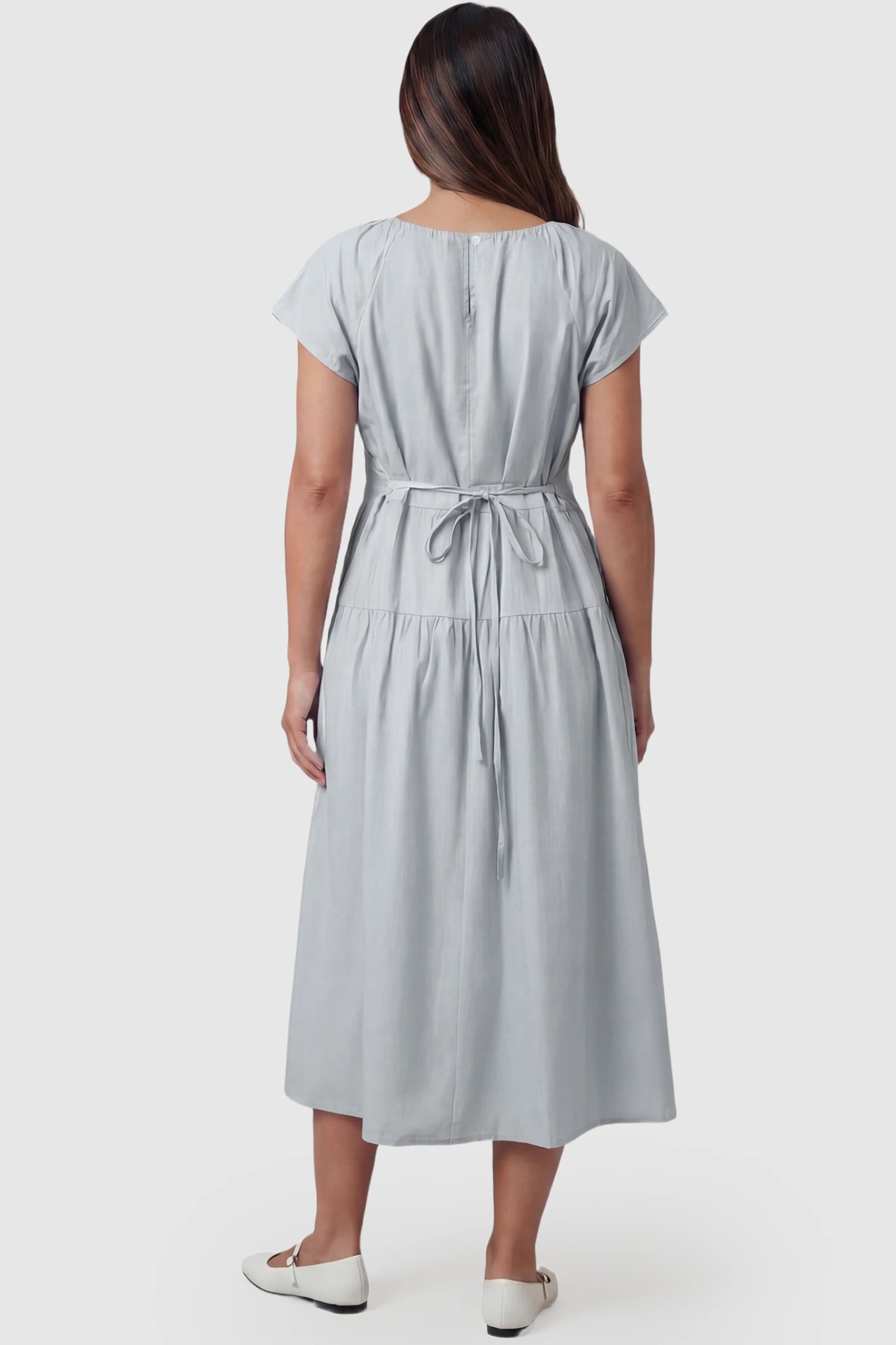 Adjustable Waist-Tie A-Line Maternity Midi Dress Adjustable waist-tie A-line maternity midi dress in blue with adjustable tie waist, back view on pregnant model