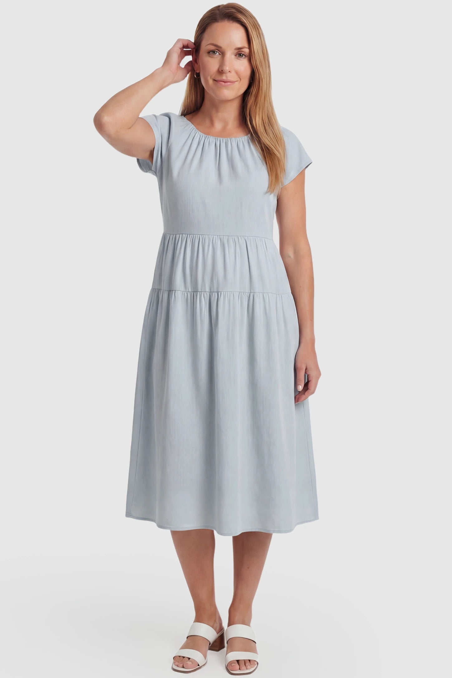 Adjustable Waist-Tie A-Line Maternity Midi Dress Adjustable waist-tie A-line maternity midi dress in blue with flowy A-line silhouette, front view on postpartum model