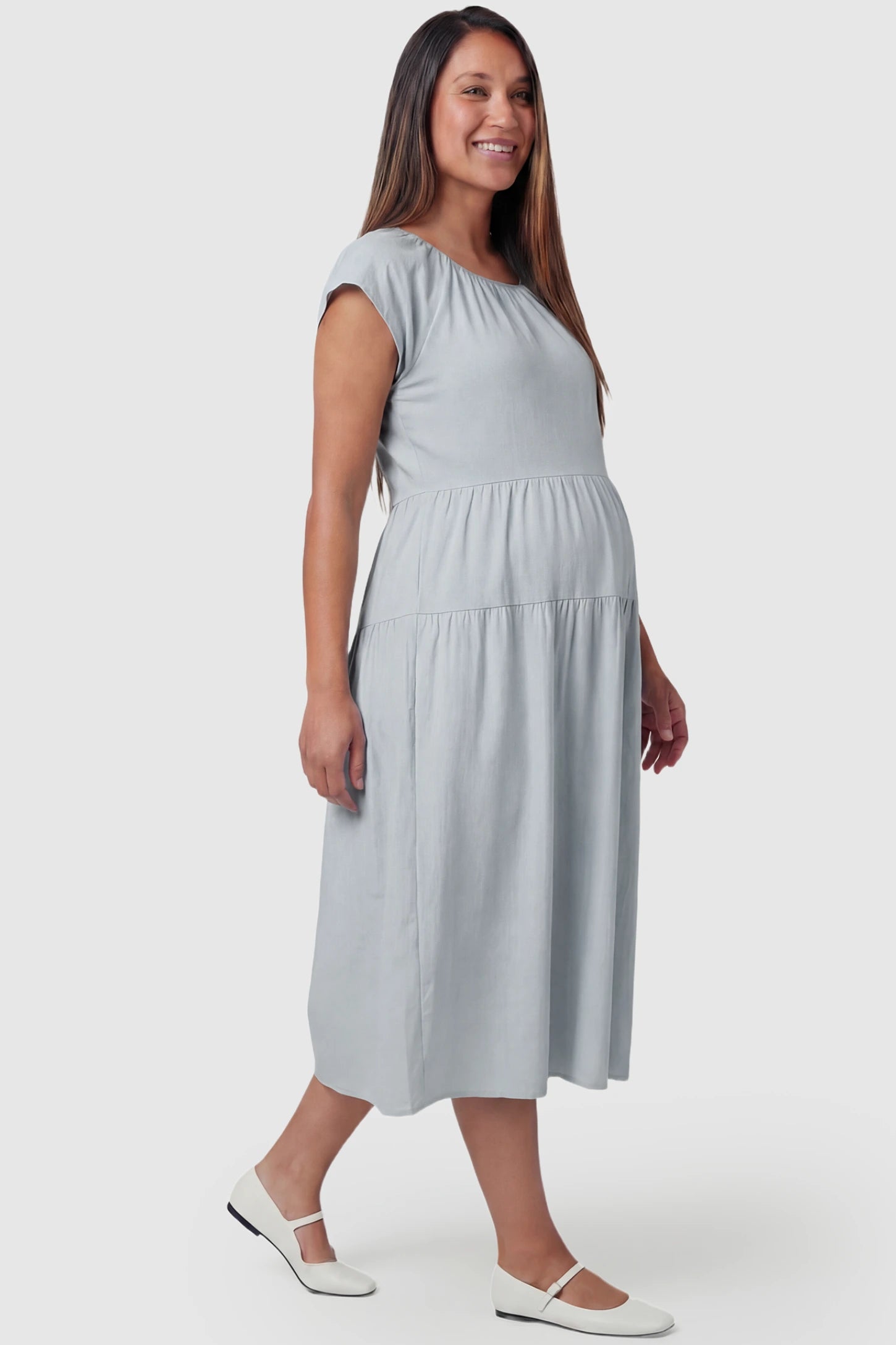 Adjustable Waist-Tie A-Line Maternity Midi Dress Adjustable waist-tie A-line maternity midi dress in blue with short sleeves, side view on pregnant model
