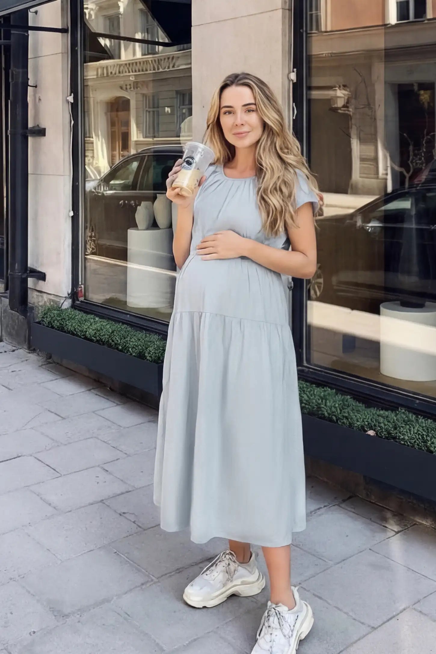 Adjustable Waist-Tie A-Line Maternity Midi Dress Adjustable waist-tie A-line maternity midi dress in blue with short sleeves, front view on pregnant model