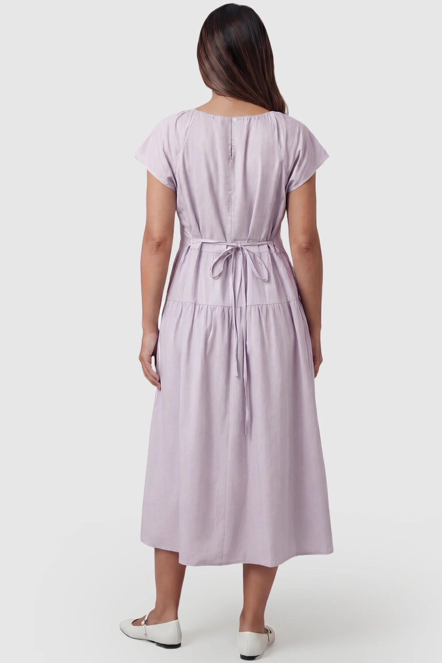Adjustable Waist-Tie A-Line Maternity Midi Dress Adjustable waist-tie A-line maternity midi dress in light purple with adjustable tie waist, back view on pregnant model