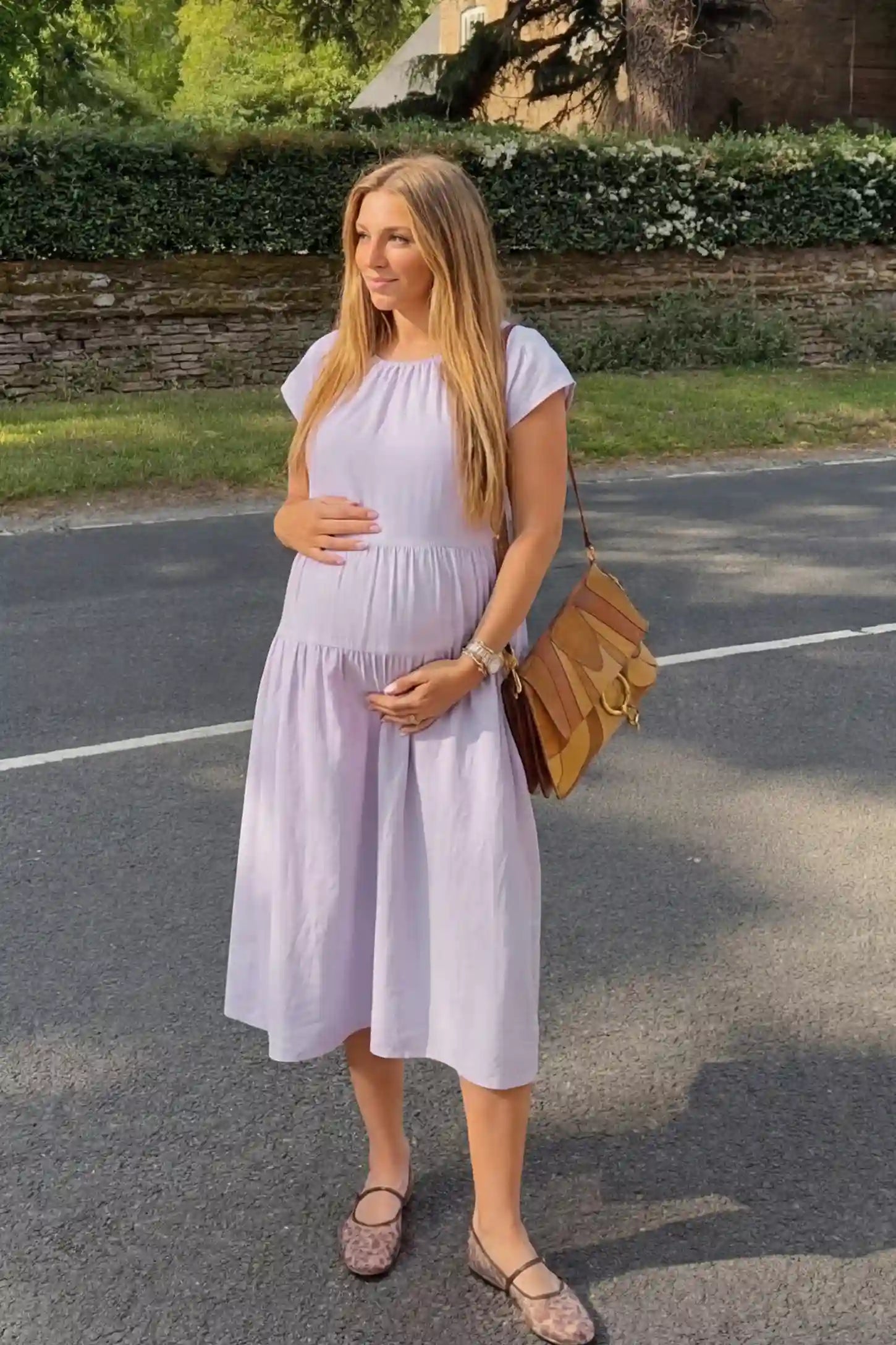 Adjustable Waist-Tie A-Line Maternity Midi Dress Adjustable waist-tie A-line maternity midi dress in light purple with short sleeves, front view on pregnant model