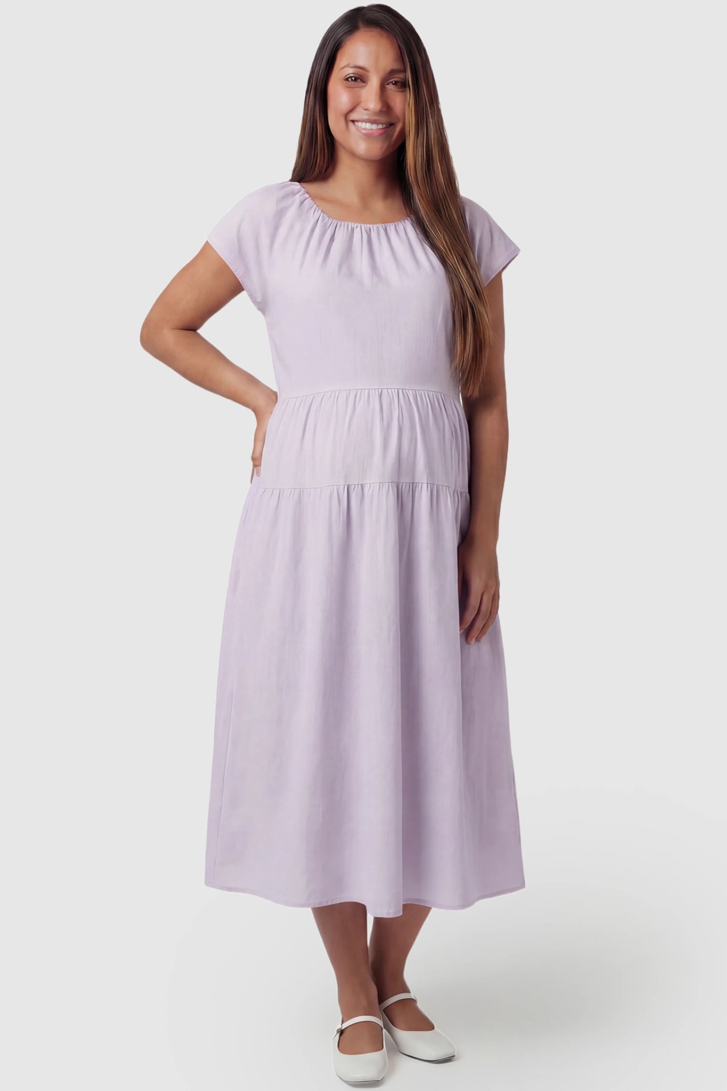 Adjustable Waist-Tie A-Line Maternity Midi Dress Adjustable waist-tie A-line maternity midi dress in light purple with flowy A-line silhouette, front view on pregnant model