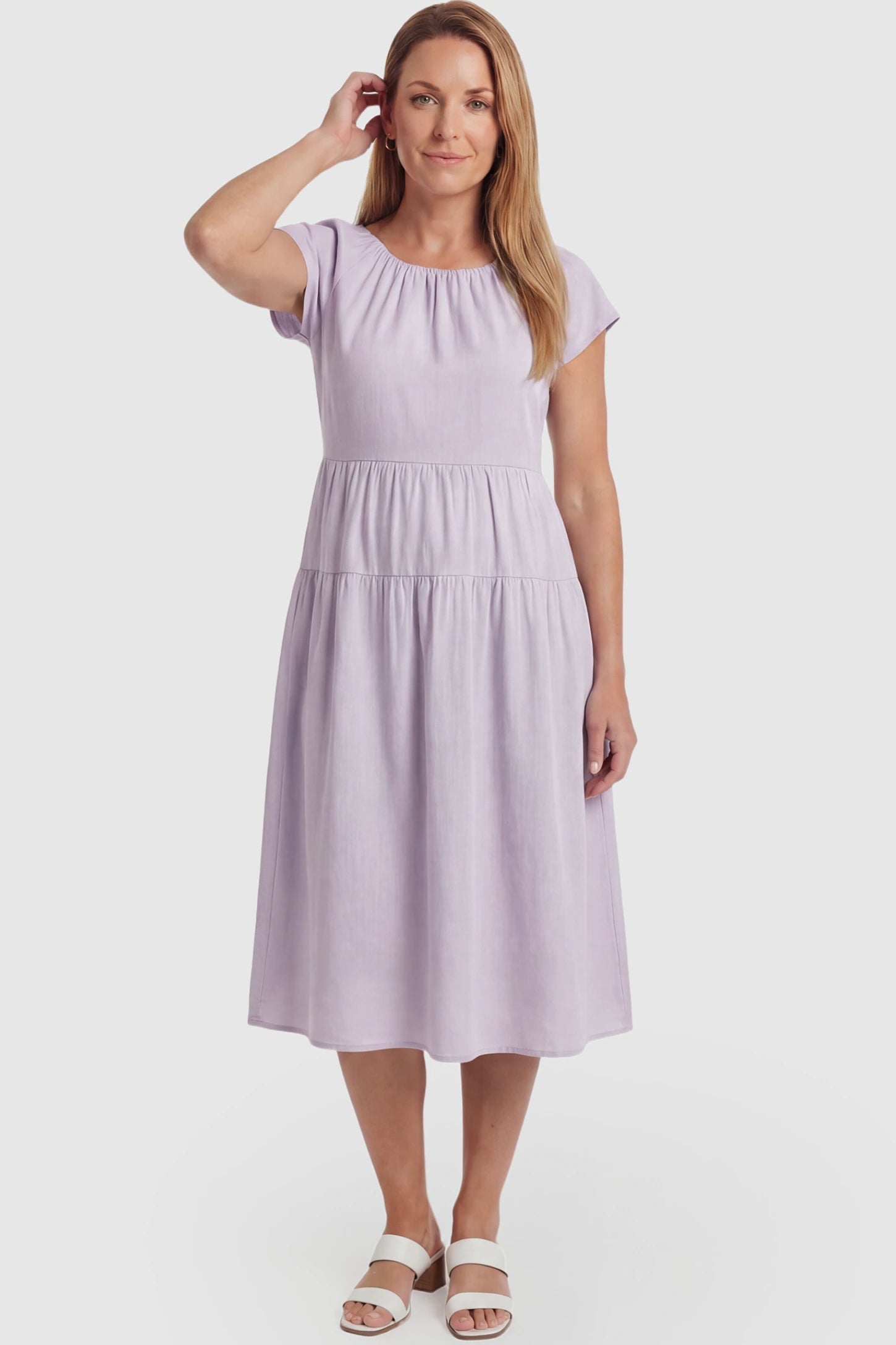 Adjustable Waist-Tie A-Line Maternity Midi Dress Adjustable waist-tie A-line maternity midi dress in light purple with flowy A-line silhouette, front view on postpartum model