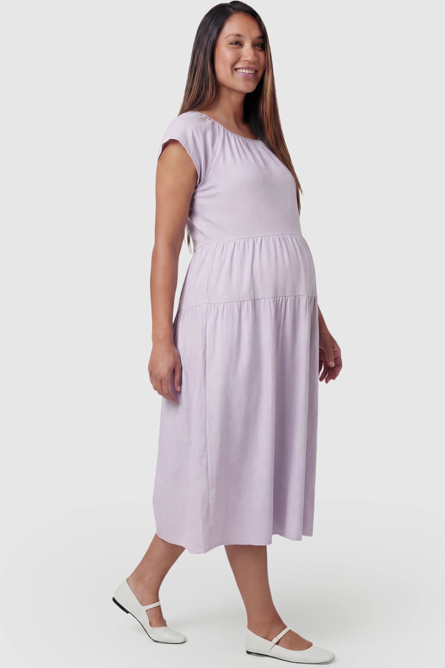 Adjustable Waist-Tie A-Line Maternity Midi Dress Adjustable waist-tie A-line maternity midi dress in light purple with short sleeves, side view on pregnant model