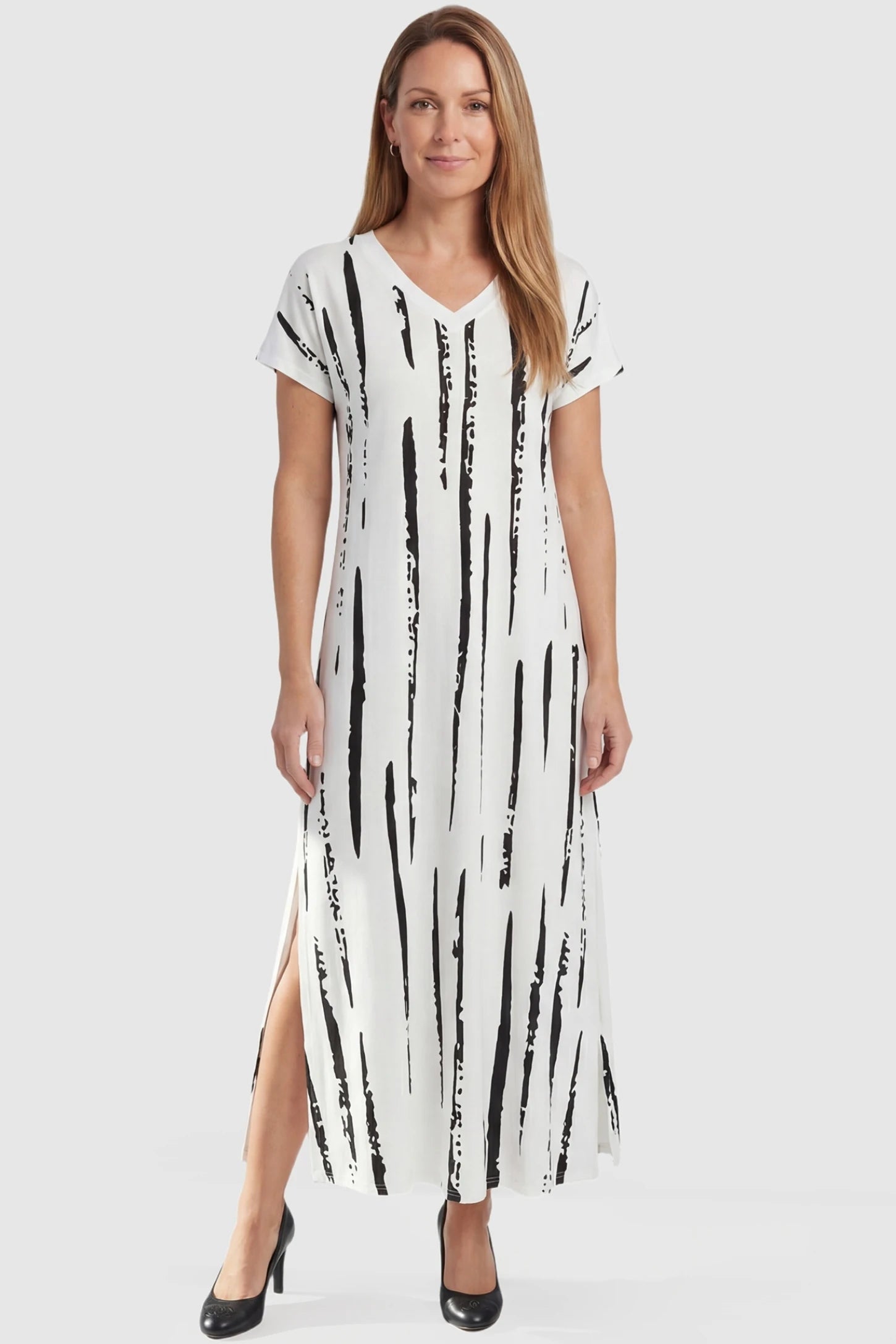 Abstract Stripe V-Neck Maxi Maternity Dress Abstract Stripe V-Neck Maxi Maternity Dress in Black Stripe featuring a V-neckline on a non-pregnant model, front view.
