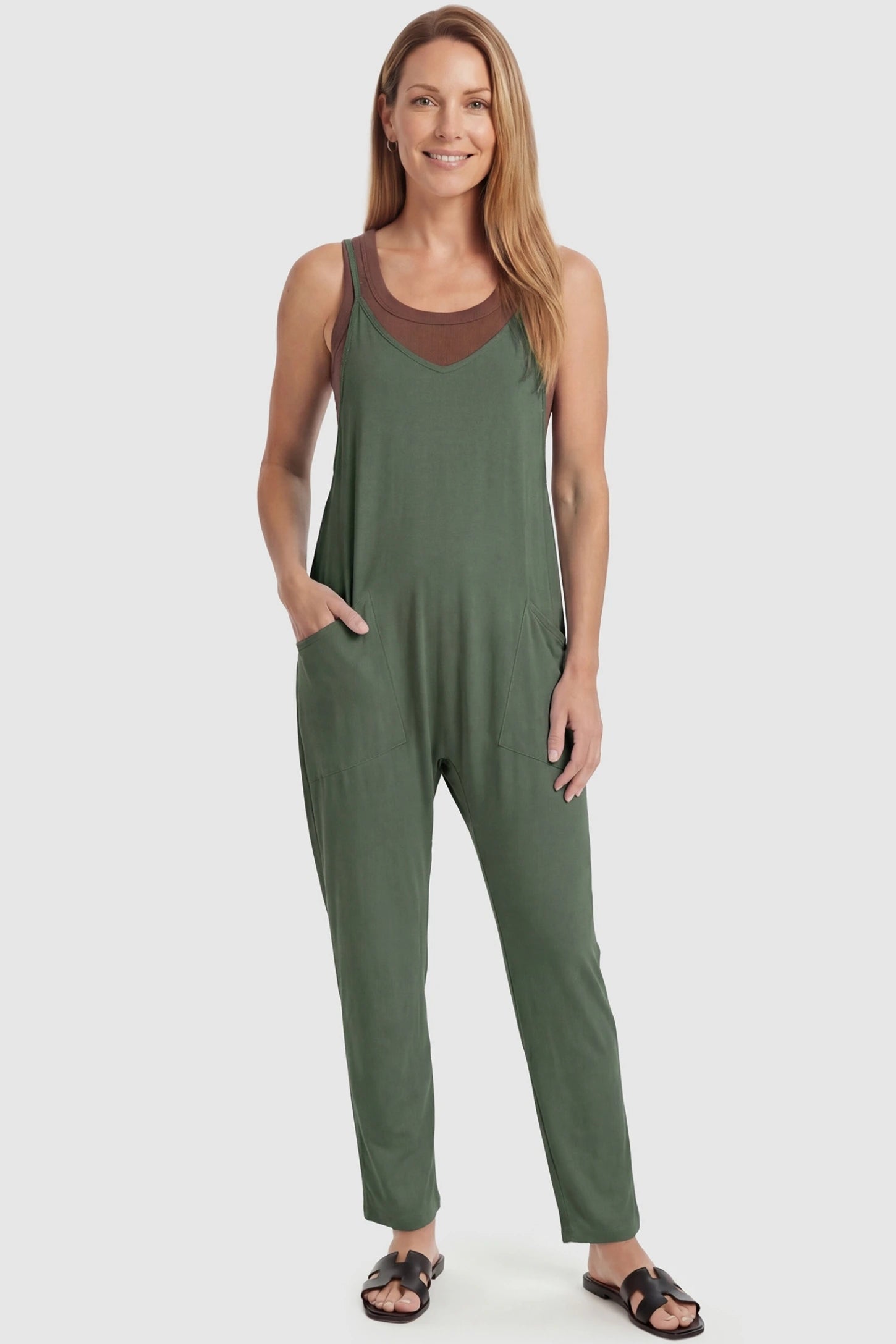 Adjustable Strap Pocketed Relaxed Maternity Jumpsuit Adjustable Strap Relaxed Maternity Jumpsuit in Army Green featuring a loose fit and functional pockets on a non-pregnant model.