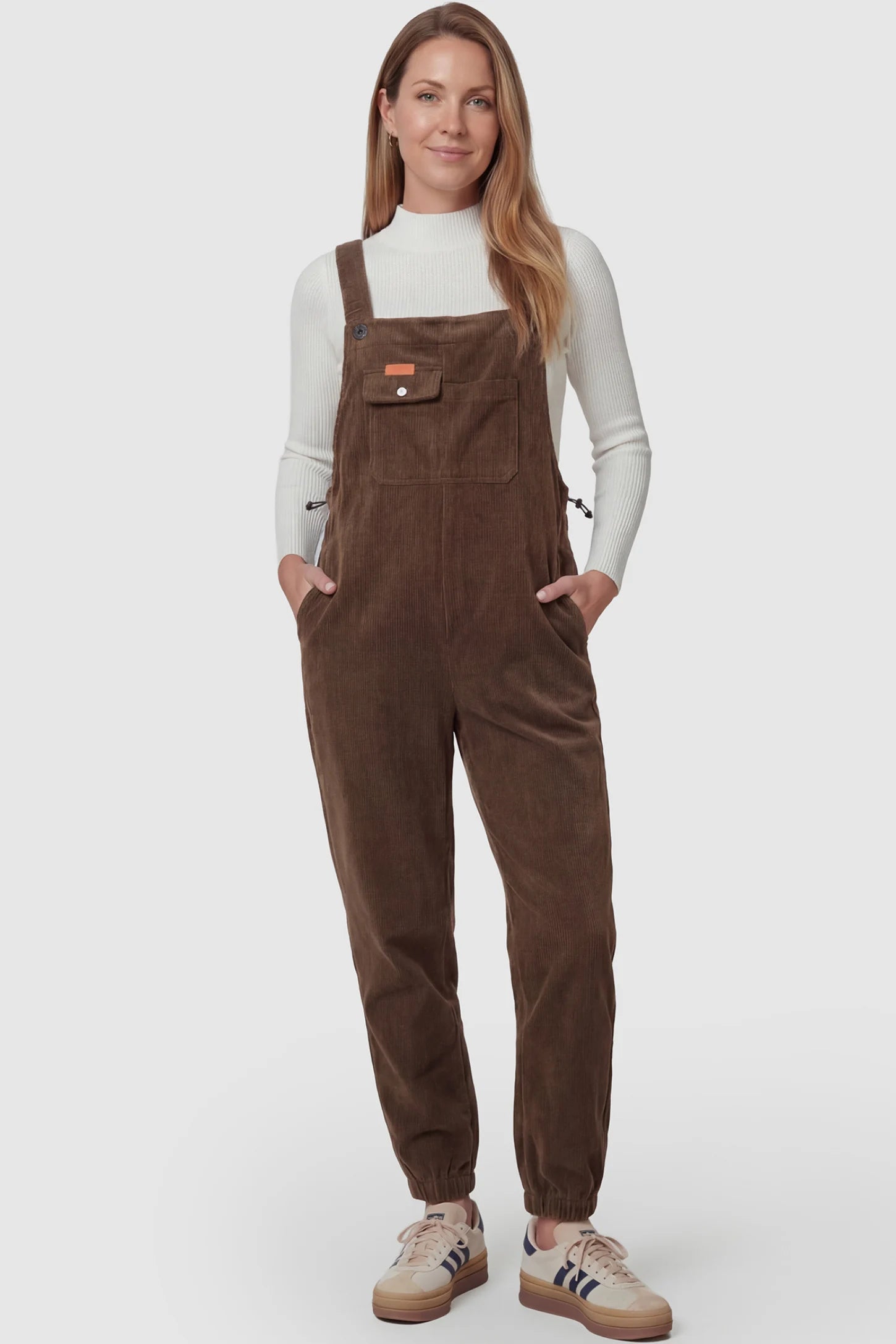 Adjustable Strap Loose Fit Maternity Overalls Adjustable strap loose fit maternity overalls in brown featuring wide leg design on a pregnant model