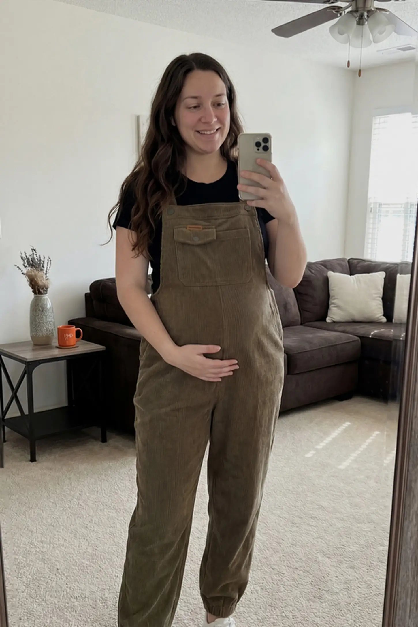 Adjustable Strap Loose Fit Maternity Overalls Adjustable strap loose fit maternity overalls in brown featuring wide leg design on a pregnant model