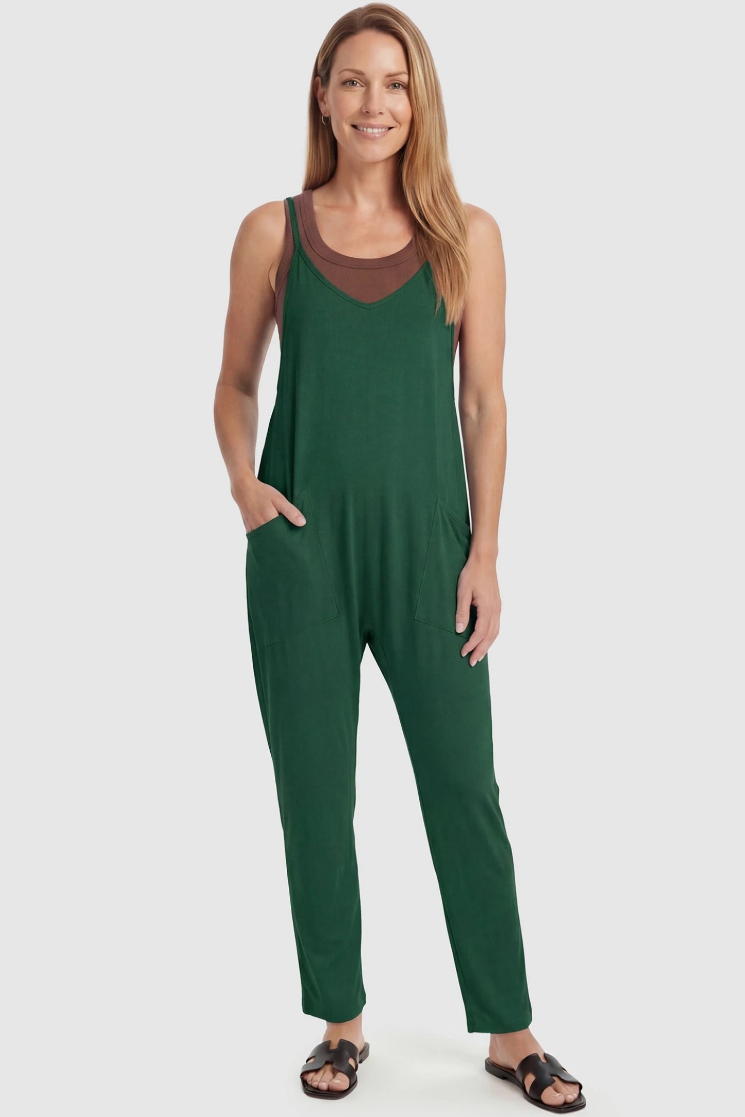 Adjustable Strap Pocketed Relaxed Maternity Jumpsuit Adjustable Strap Relaxed Maternity Jumpsuit in Dark Green featuring a loose fit and functional pockets on a non-pregnant model.