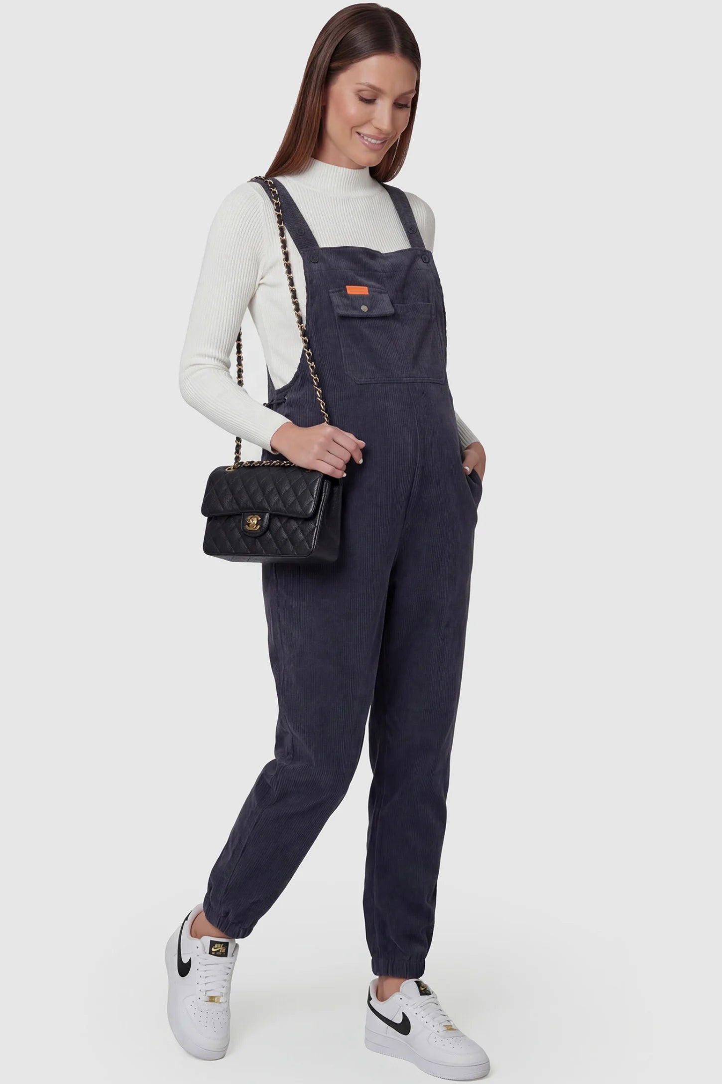 Adjustable Strap Loose Fit Maternity Overalls Adjustable strap loose fit maternity overalls in gray featuring wide leg design on a pregnant model