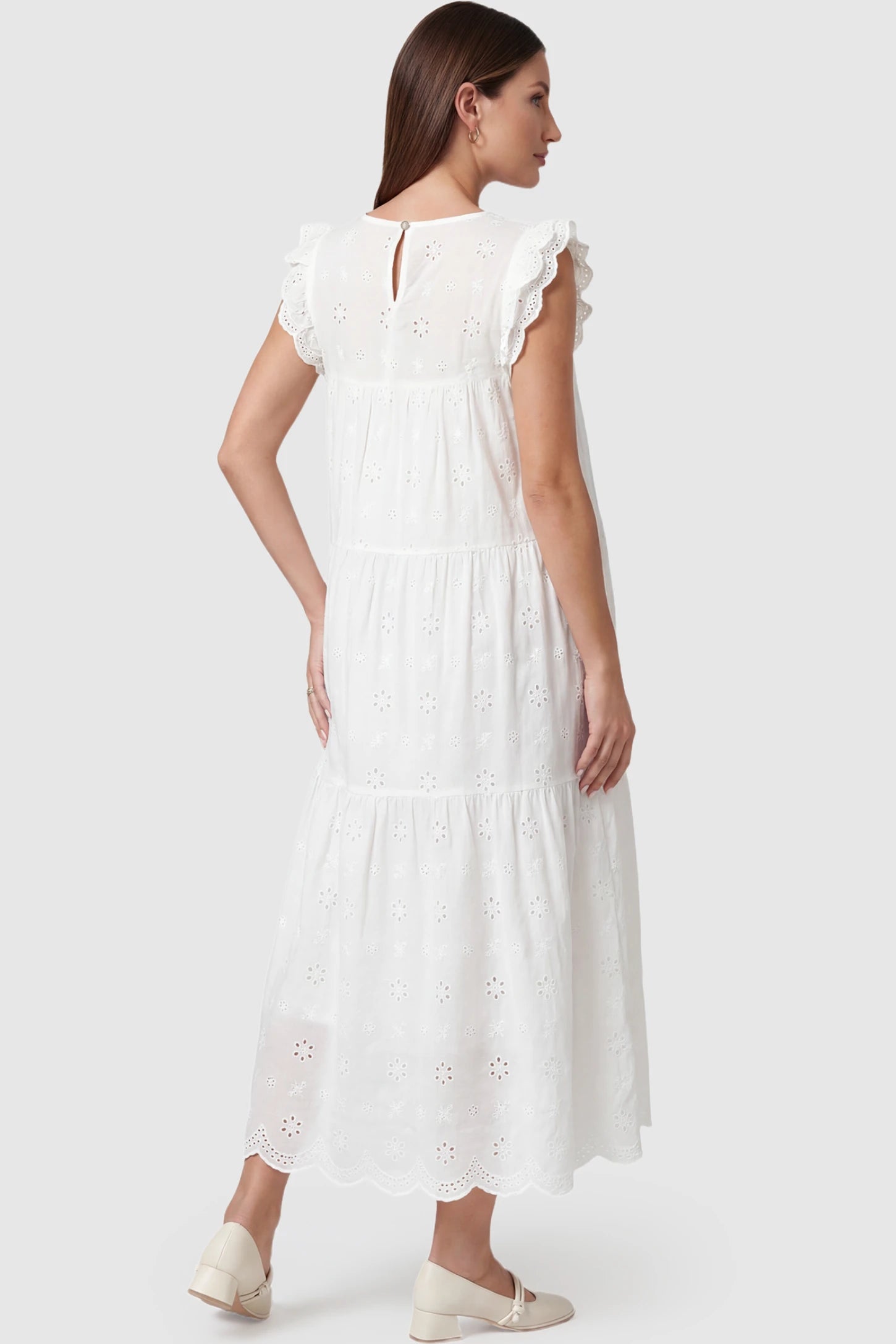 Anglaise Lace Ruffled Sleeve Tiered Maternity Maxi Dress Anglaise lace ruffled sleeve tiered maternity maxi dress in white with delicate lace detail, back view on pregnant model