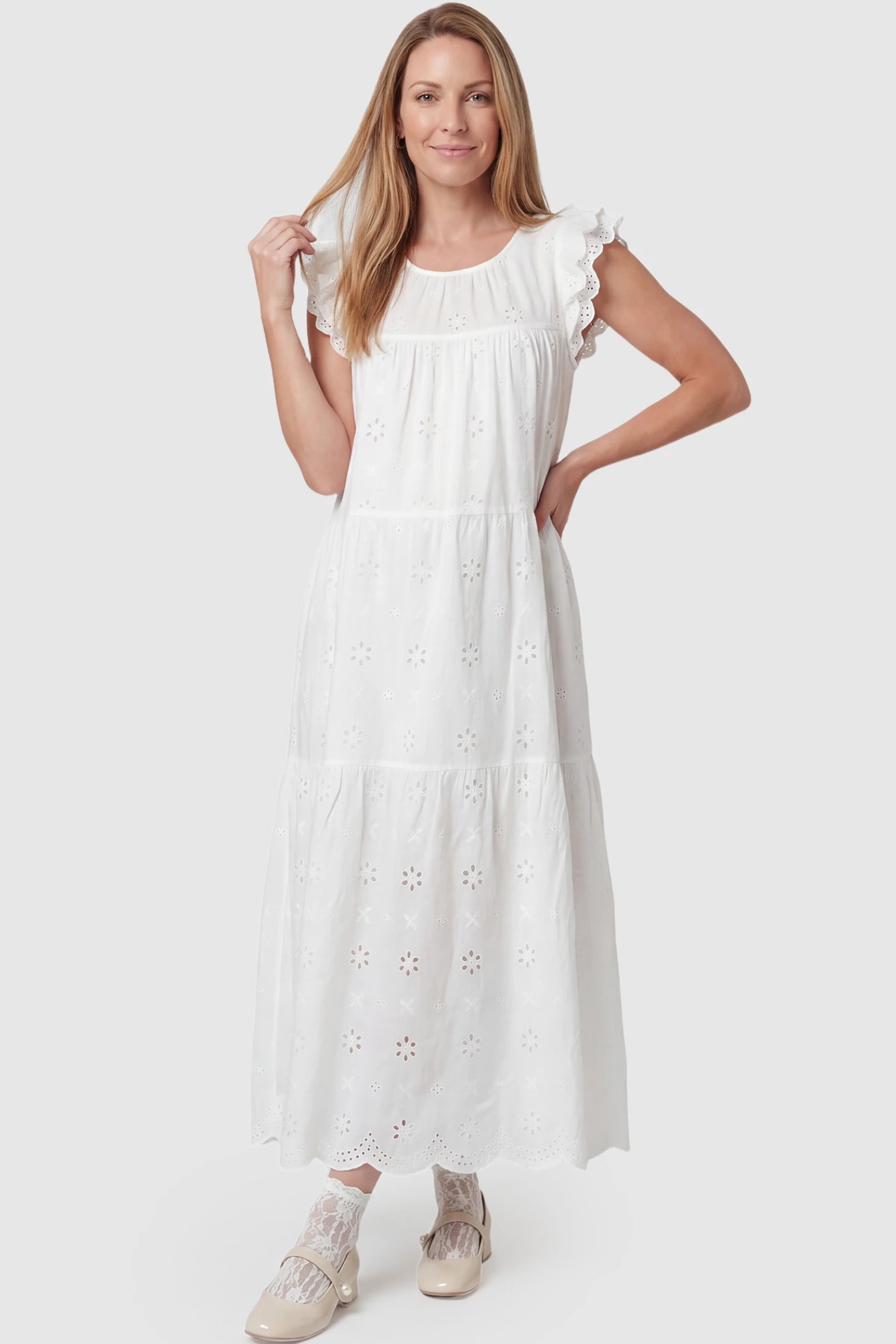 Anglaise Lace Ruffled Sleeve Tiered Maternity Maxi Dress Anglaise lace ruffled sleeve tiered maternity maxi dress in white with delicate lace detail, front view on postpartum model