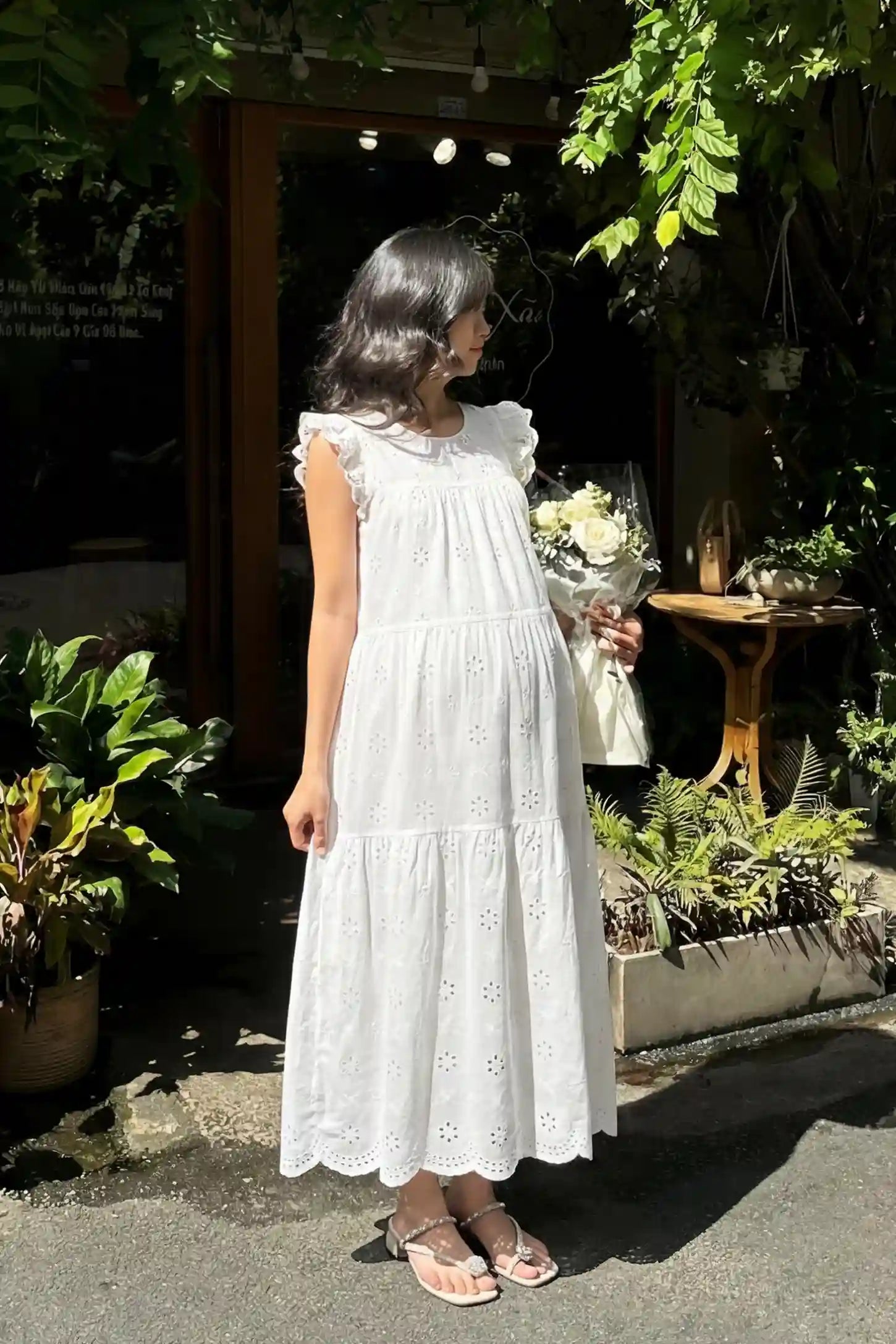 Anglaise Lace Ruffled Sleeve Tiered Maternity Maxi Dress Anglaise lace ruffled sleeve tiered maternity maxi dress in white with delicate lace detail, front view on pregnant model
