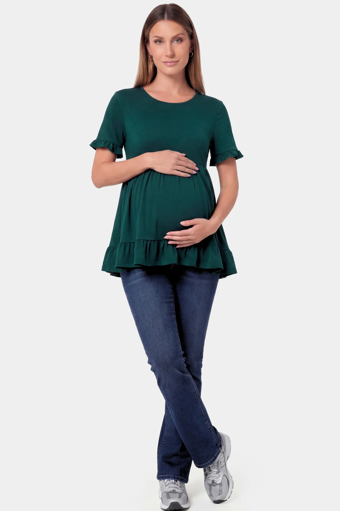 Crew Neck Babydoll Maternity Top Crew Neck Babydoll Maternity Top in dark green featuring an empire waist and flutter sleeves on a pregnant model.