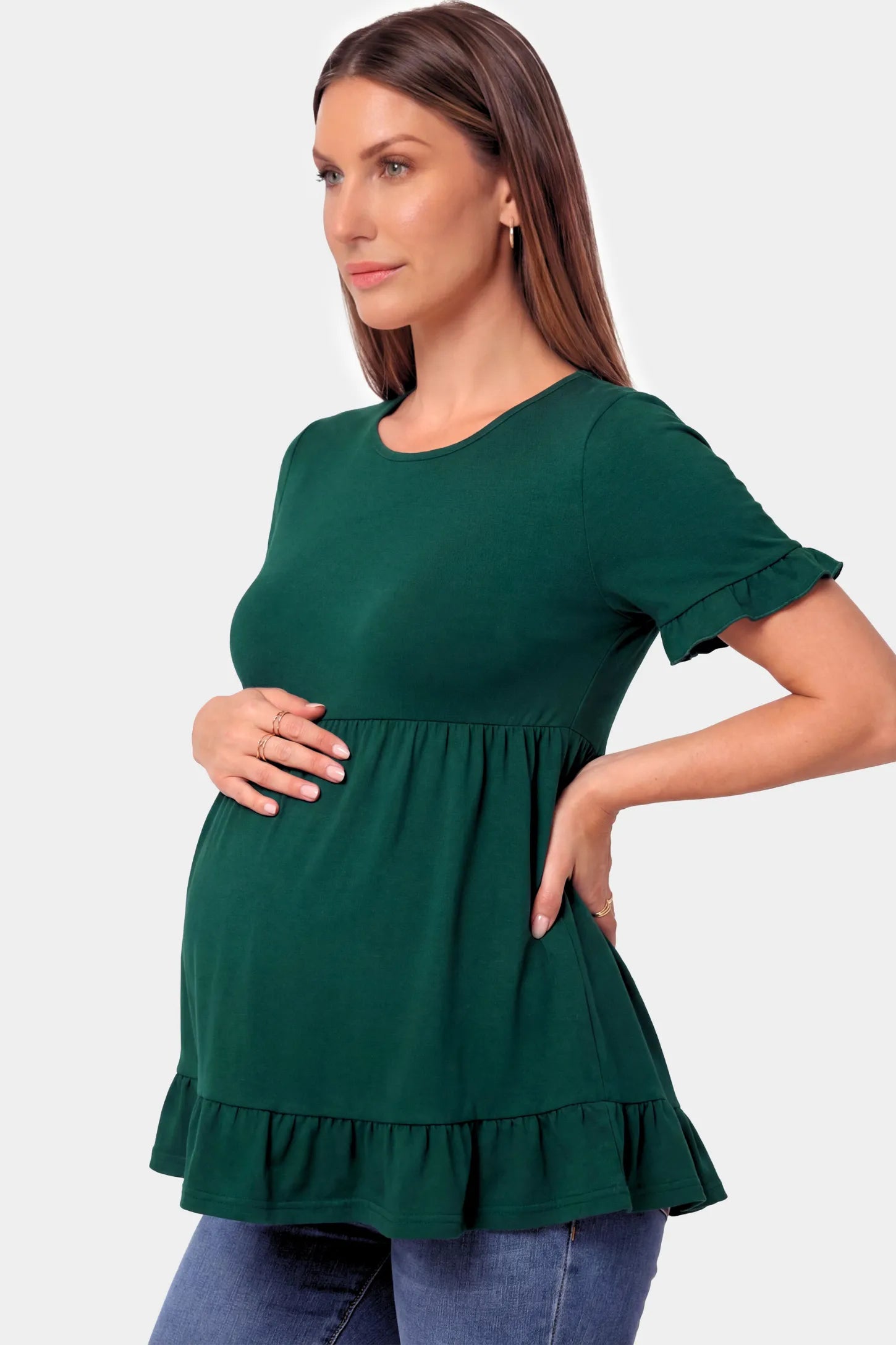 Crew Neck Babydoll Maternity Top in dark green featuring an empire waist and flutter sleeves on a pregnant model.