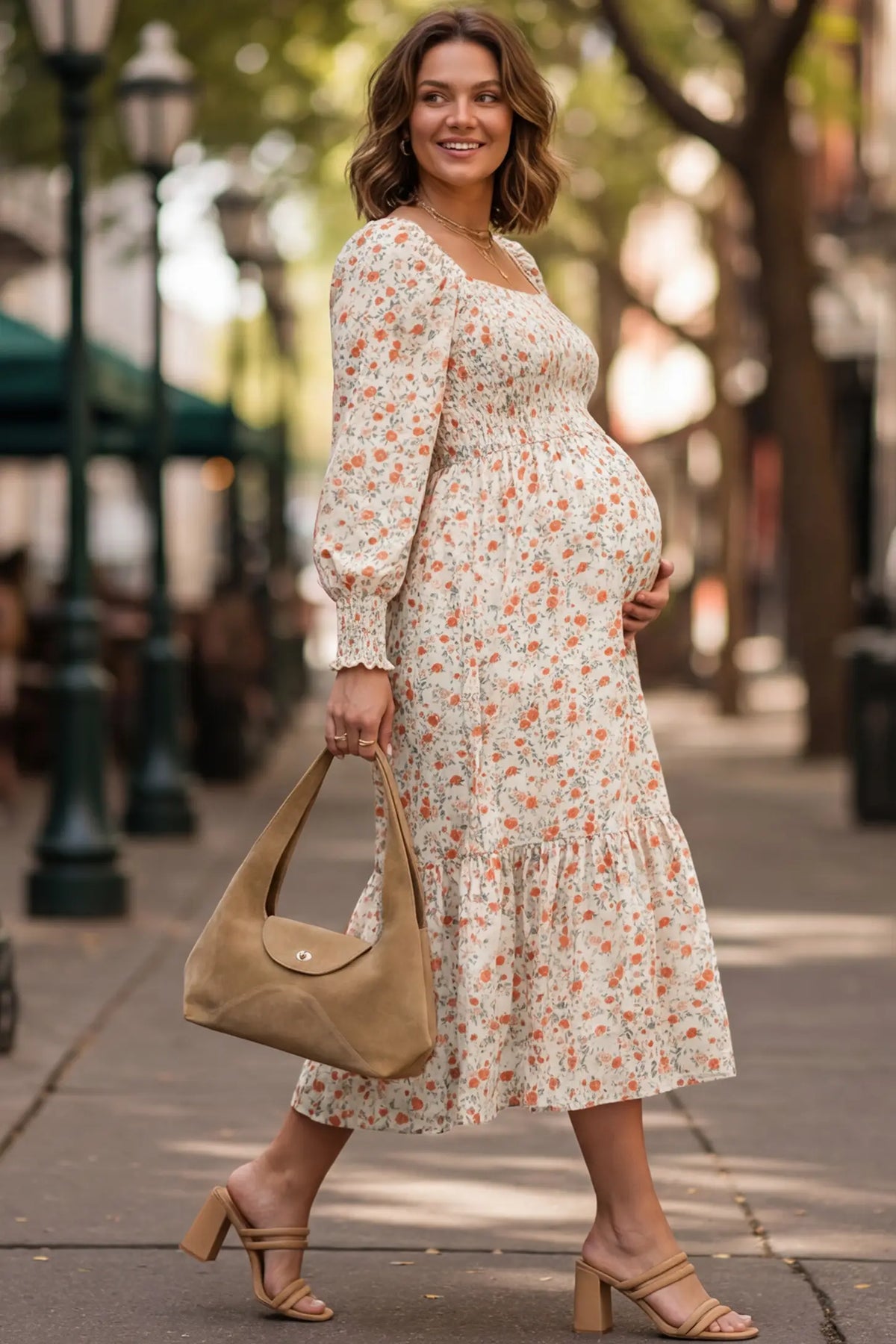 Floral Square Neck Tiered Maternity Midi Dress in white floral featuring smocked bodice and balloon sleeves on pregnant model.
