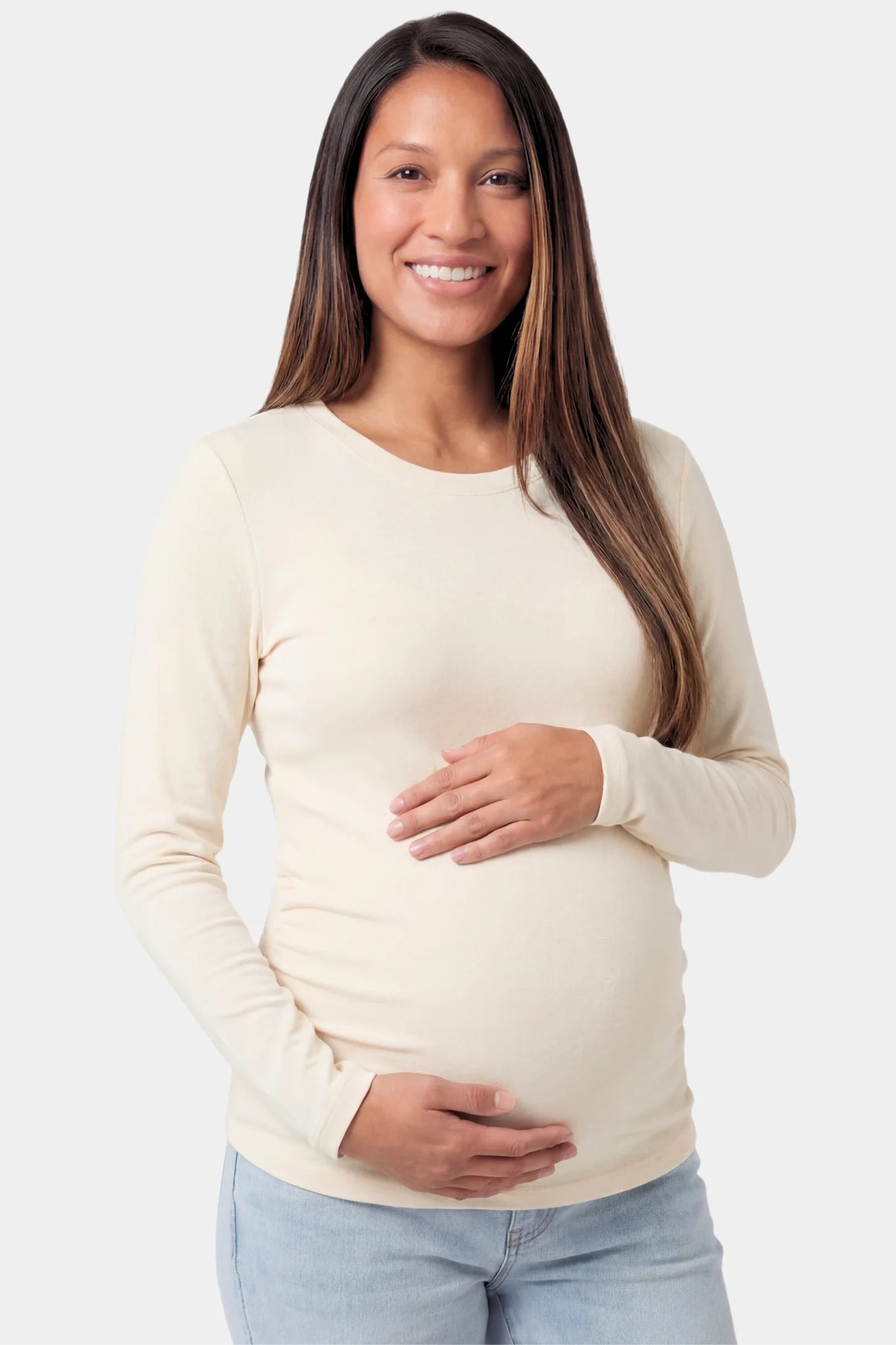 Basic Long Sleeve Maternity Top in beige featuring a soft crew neck and lightweight stretch fabric on a pregnant model.