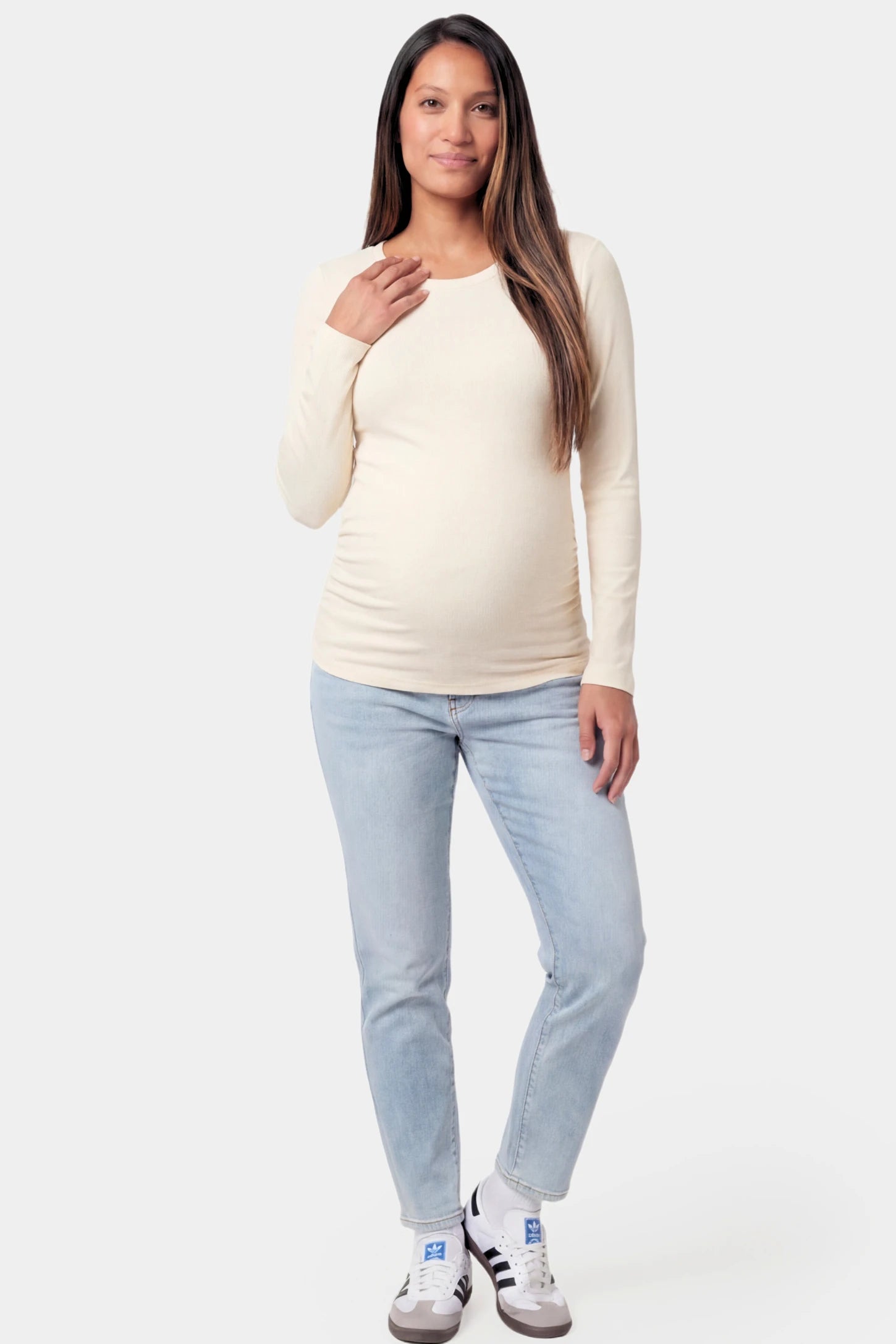 Basic Long Sleeve Maternity Top Basic Long Sleeve Maternity Top in beige featuring a soft crew neck and lightweight stretch fabric on a pregnant model.