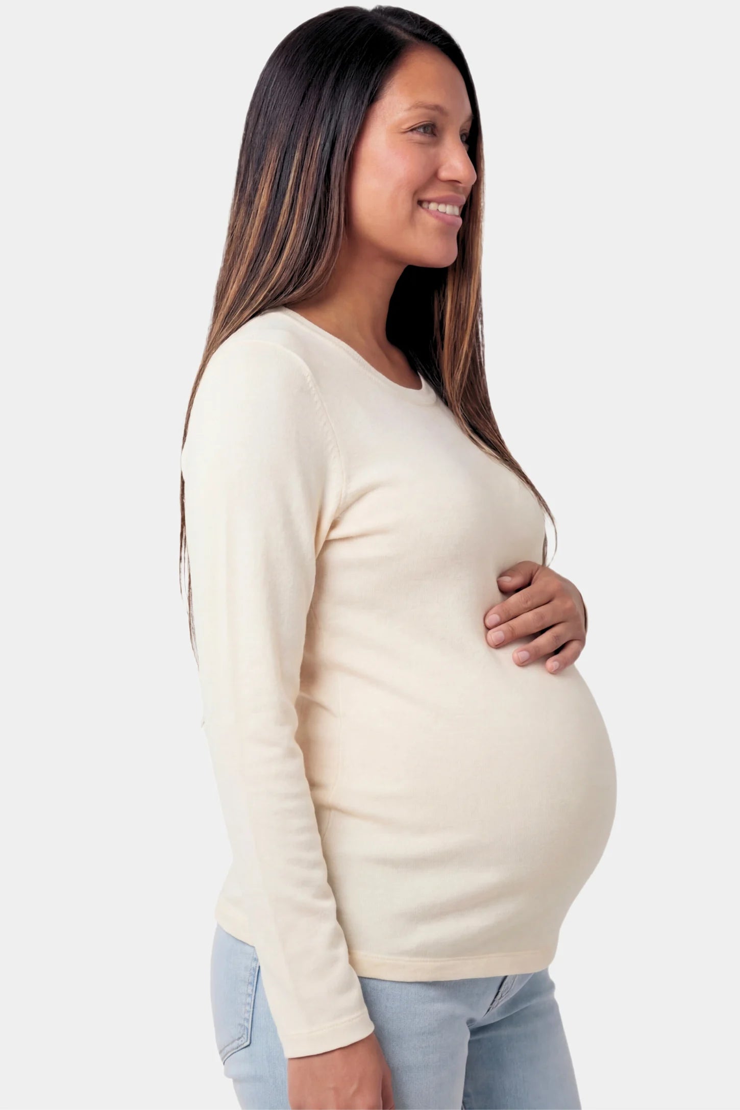 Basic Long Sleeve Maternity Top in beige featuring a soft crew neck and lightweight stretch fabric on a pregnant model.
