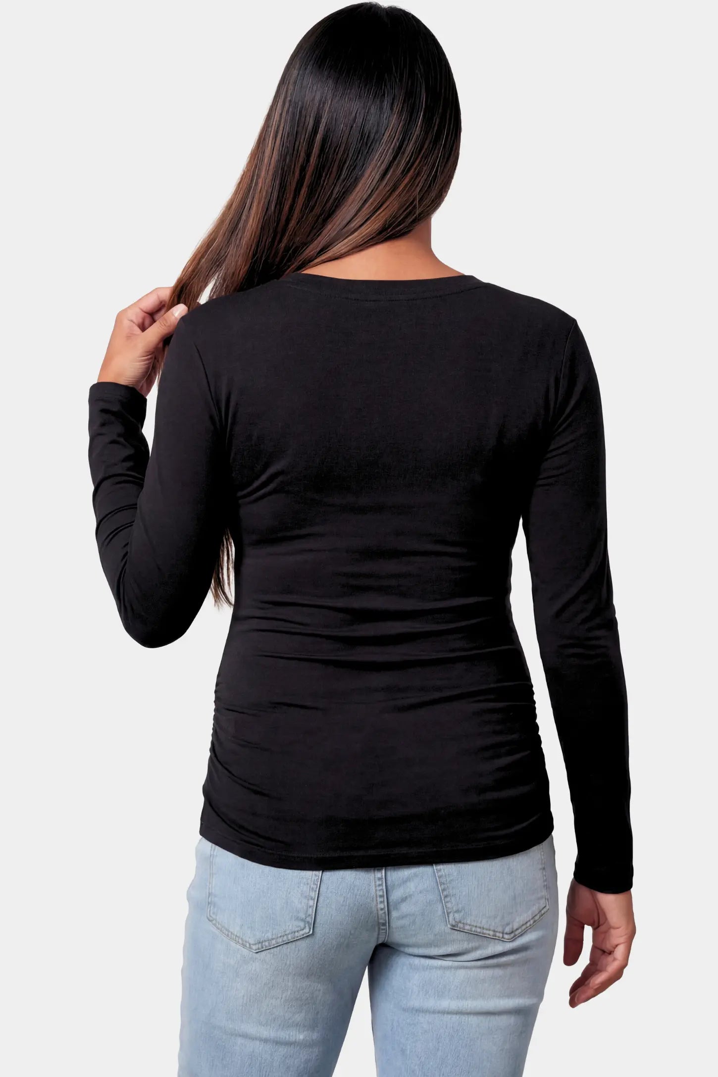 Basic Long Sleeve Maternity Top Basic Long Sleeve Maternity Top in black featuring a soft crew neck and lightweight stretch fabric on a pregnant model.
