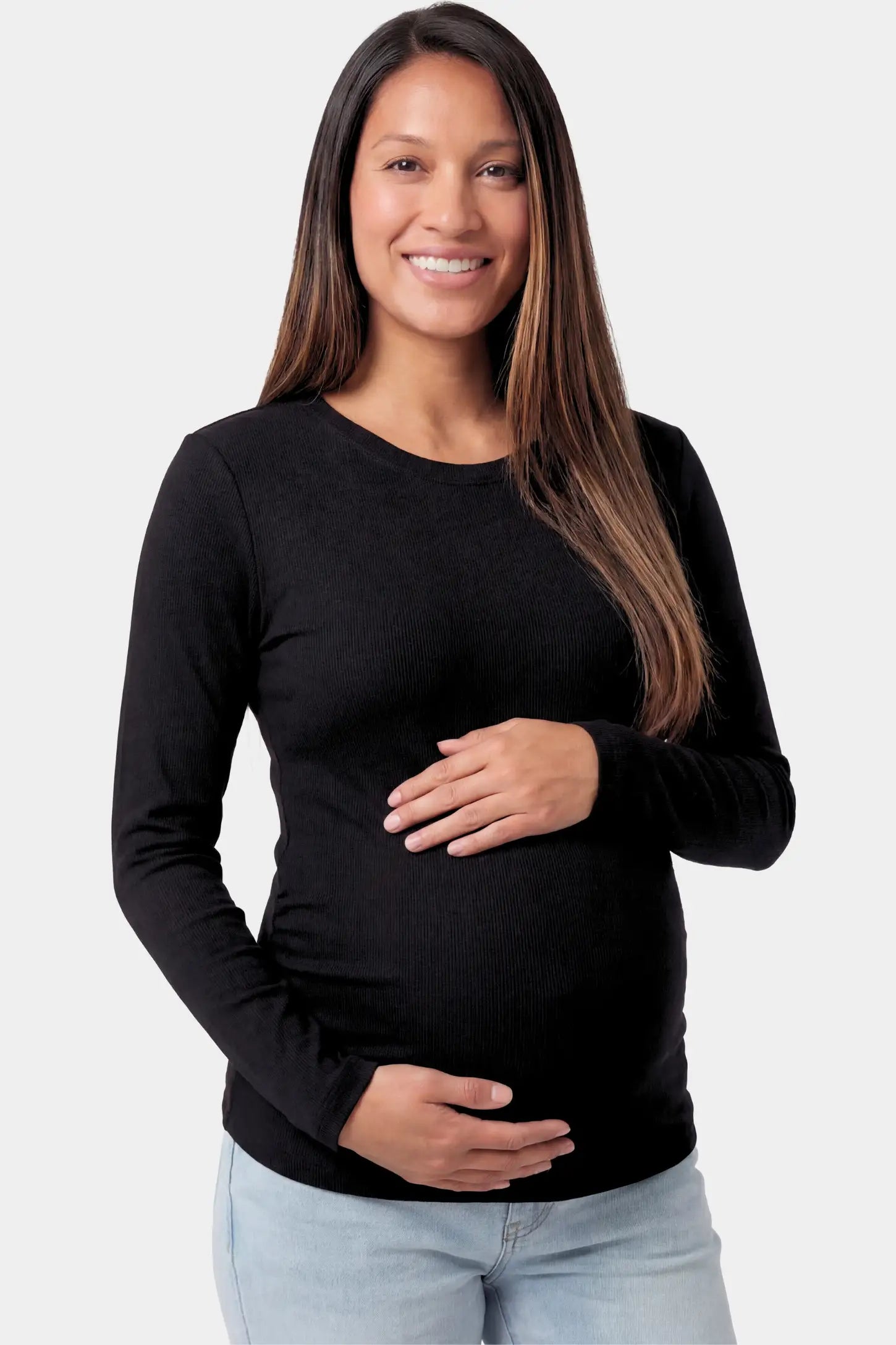 Basic Long Sleeve Maternity Top Basic Long Sleeve Maternity Top in black featuring a soft crew neck and lightweight stretch fabric on a pregnant model.
