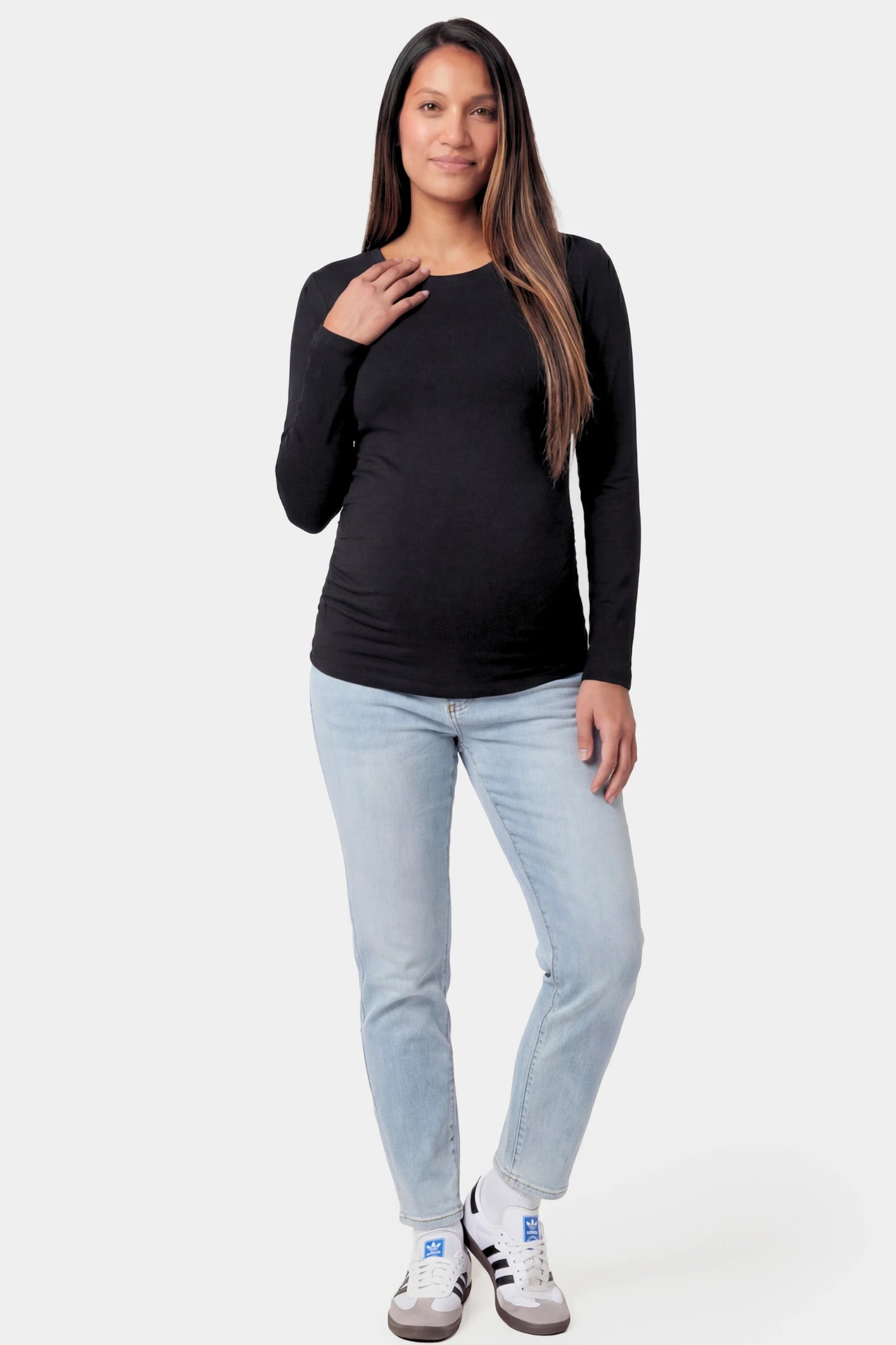 Basic Long Sleeve Maternity Top Basic Long Sleeve Maternity Top in black featuring a soft crew neck and lightweight stretch fabric on a pregnant model.