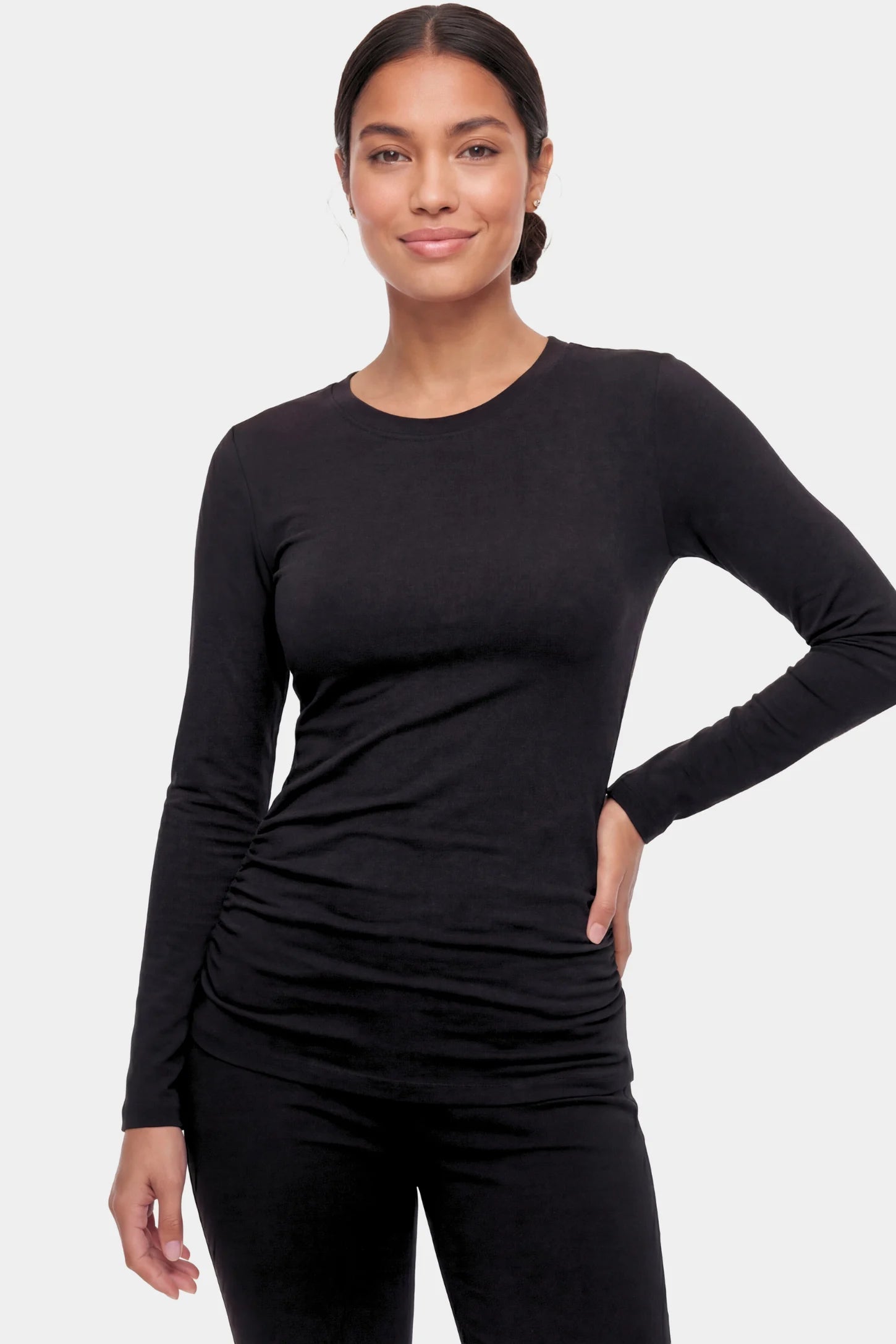Basic Long Sleeve Maternity Top Basic Long Sleeve Maternity Top in black featuring a soft crew neck and lightweight stretch fabric on a non pregnant model.