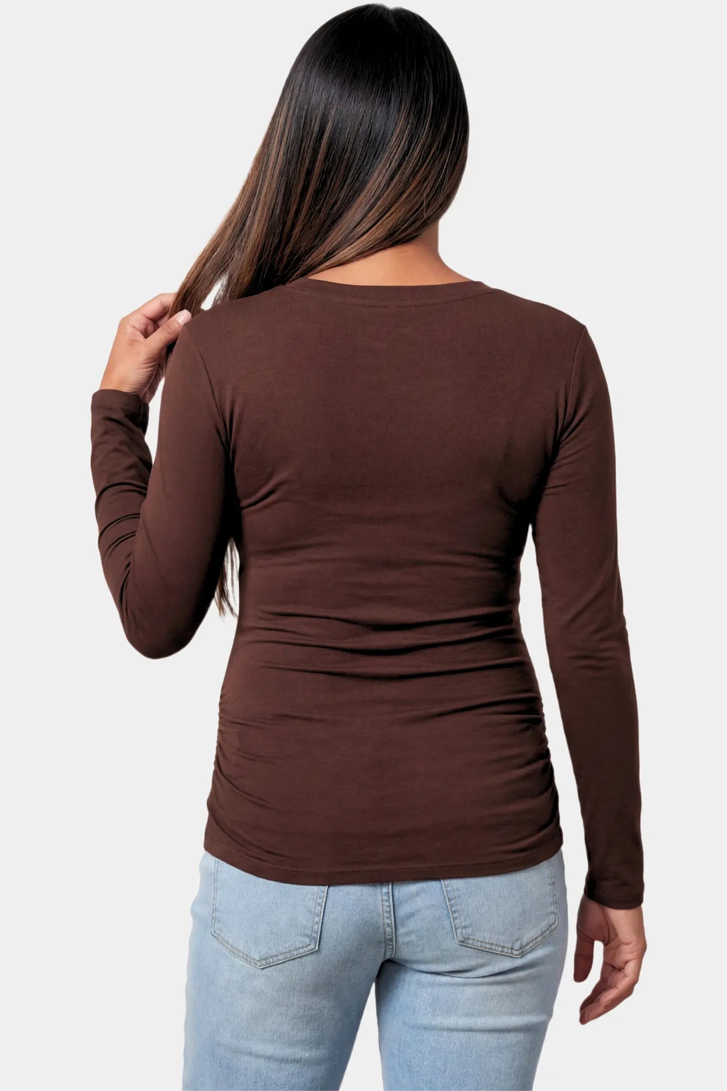 Basic Long Sleeve Maternity Top Basic Long Sleeve Maternity Top in dark brown featuring a soft crew neck and lightweight stretch fabric on a pregnant model.