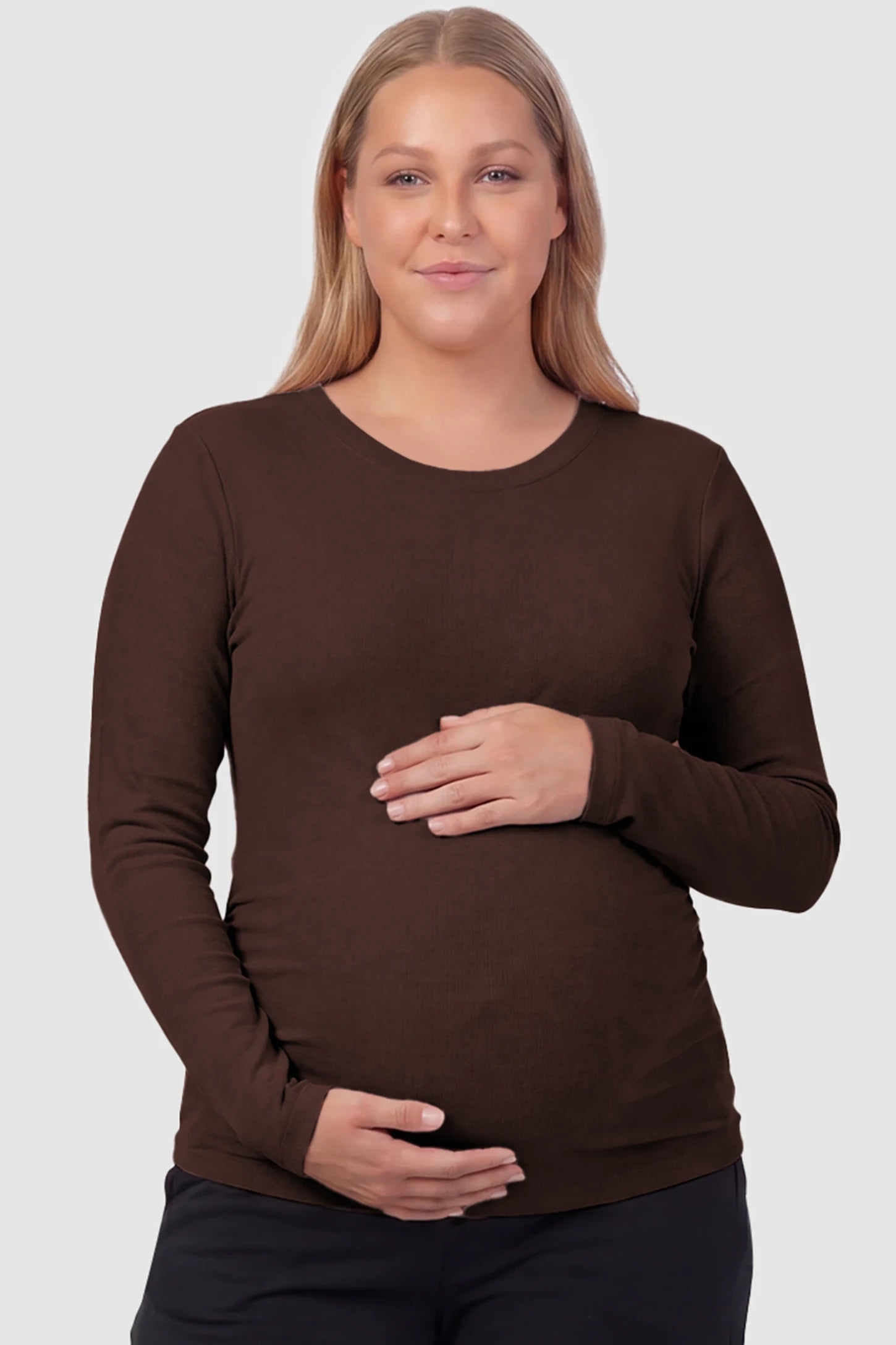 Basic Long Sleeve Maternity Top Basic Long Sleeve Maternity Top in dark brown featuring a soft crew neck and lightweight stretch fabric on a plus size pregnant model, front view