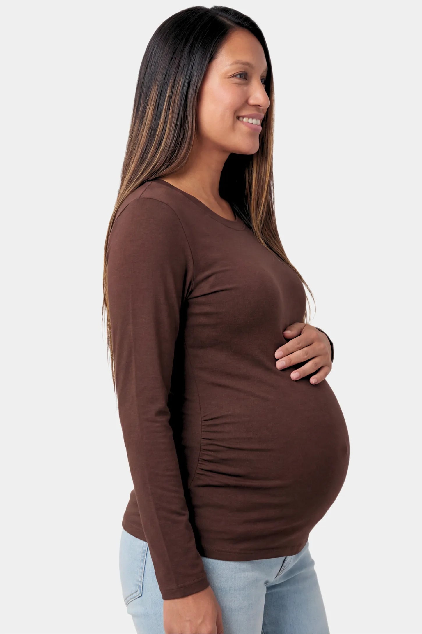Basic Long Sleeve Maternity Top Basic Long Sleeve Maternity Top in dark brown featuring a soft crew neck and lightweight stretch fabric on a pregnant model.