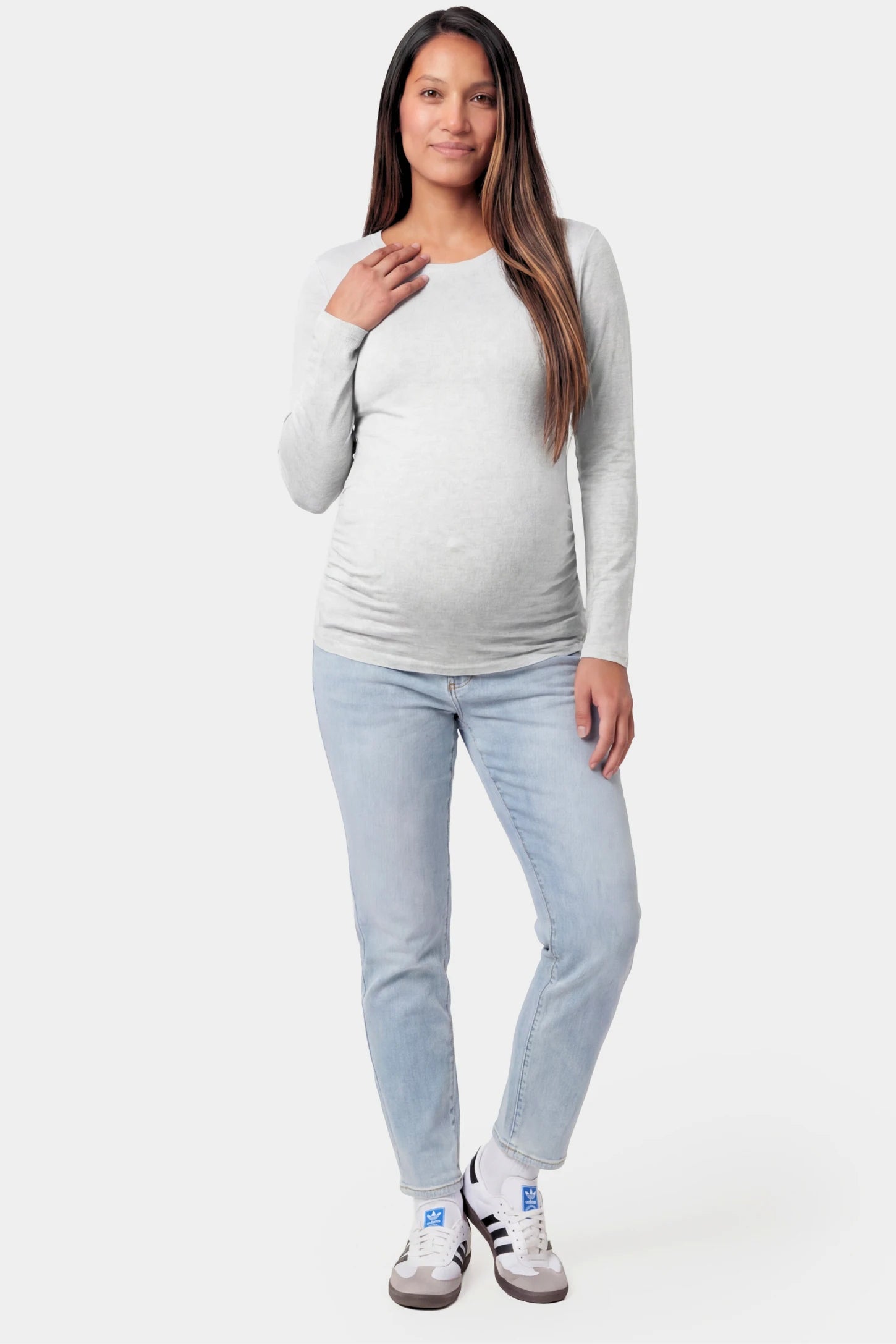 Basic Long Sleeve Maternity Top Basic Long Sleeve Maternity Top in gray featuring a soft crew neck and lightweight stretch fabric on a pregnant model.