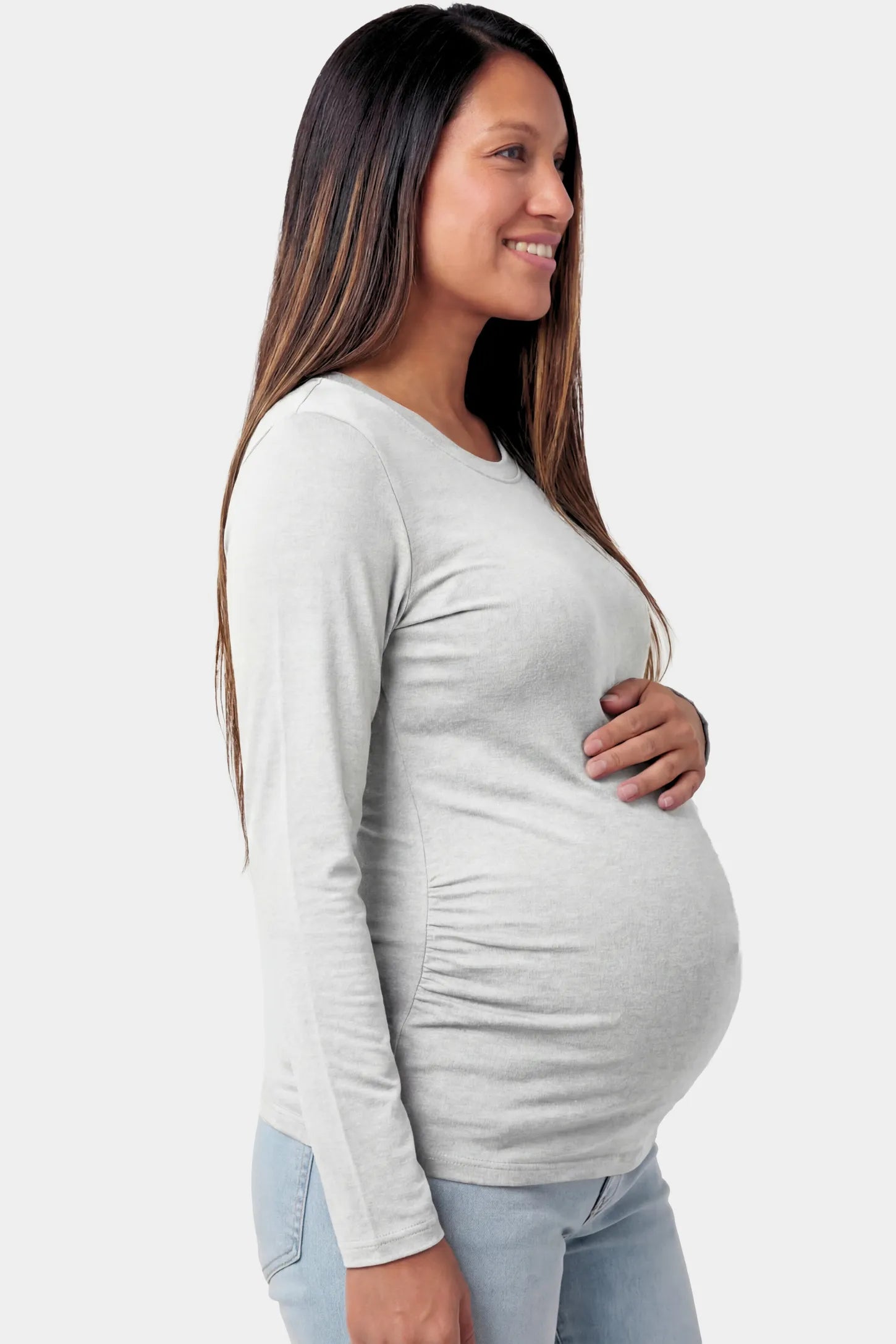 Basic Long Sleeve Maternity Top Basic Long Sleeve Maternity Top in gray featuring a soft crew neck and lightweight stretch fabric on a pregnant model.