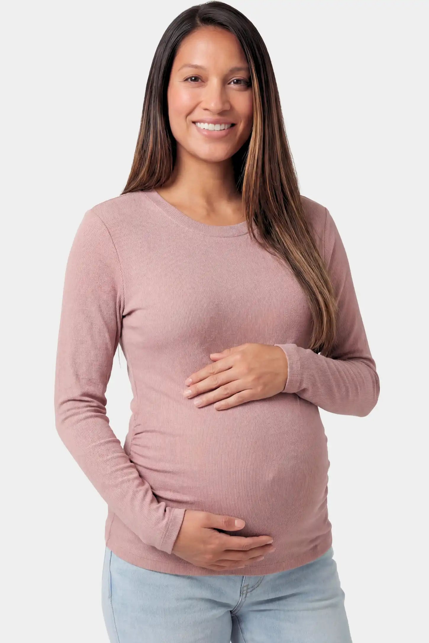 Basic Long Sleeve Maternity Top Basic Long Sleeve Maternity Top in light brown featuring a soft crew neck and lightweight stretch fabric on a pregnant model.
