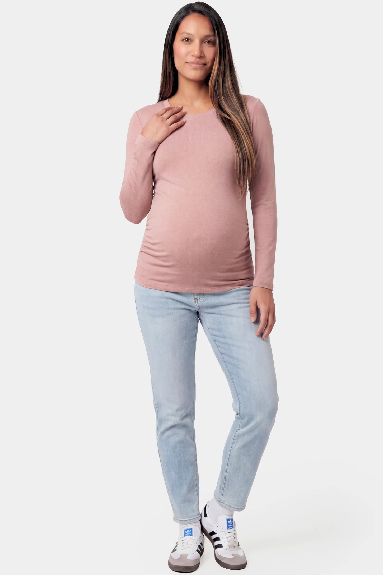 Basic Long Sleeve Maternity Top Basic Long Sleeve Maternity Top in light brown featuring a soft crew neck and lightweight stretch fabric on a pregnant model.