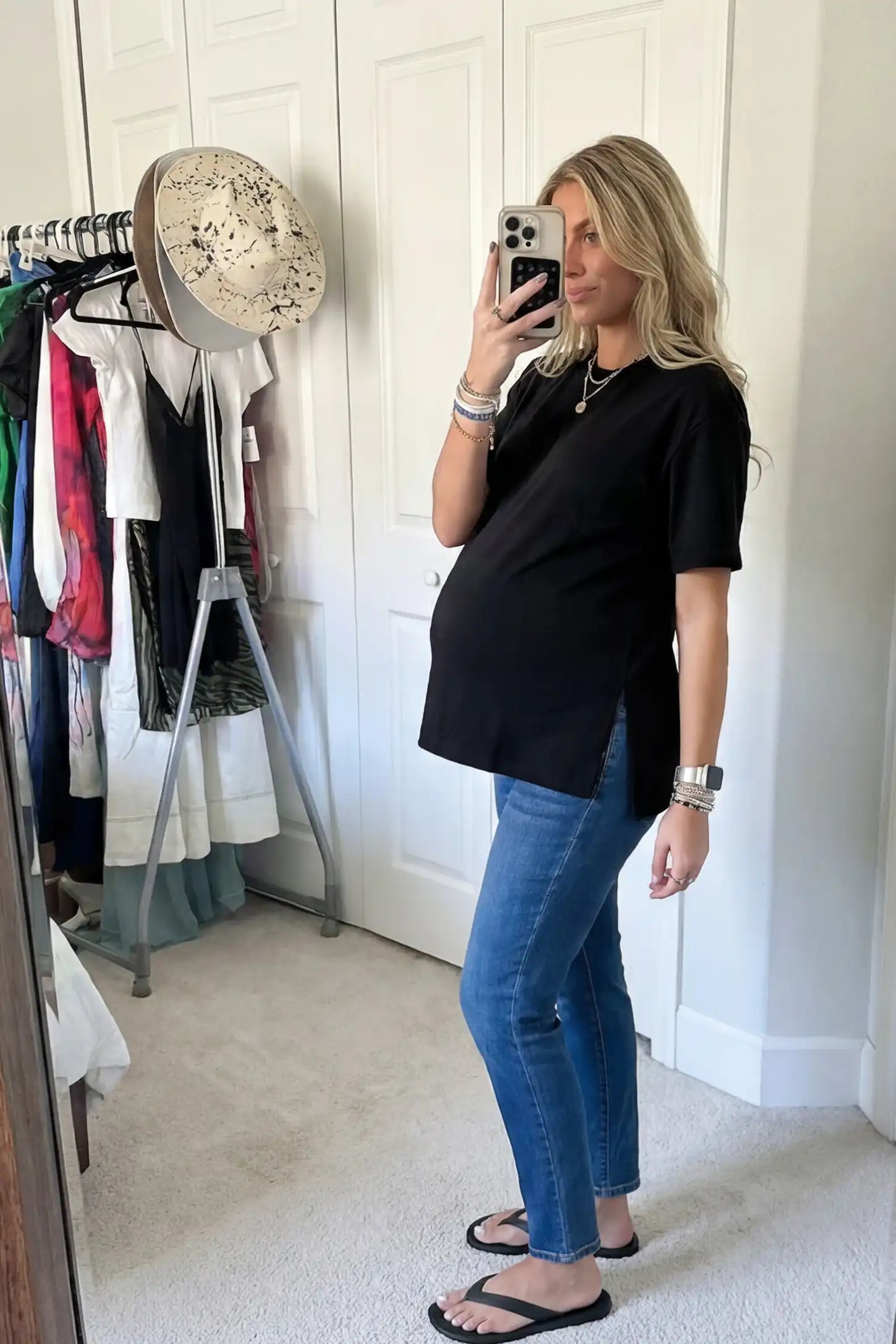 Basic One-Sided Slit Short Sleeve Maternity Top Basic one-sided slit short sleeve maternity top in black with short sleeves, side view on pregnant model