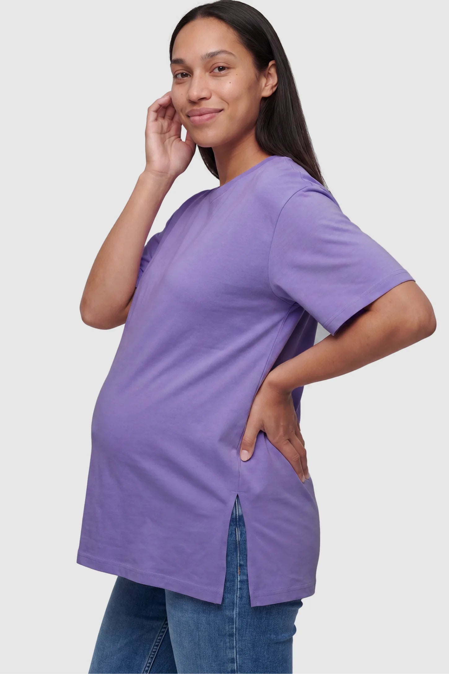 Basic One-Sided Slit Short Sleeve Maternity Top Basic one-sided slit short sleeve maternity top in purple with one-sided slit, side view on pregnant model