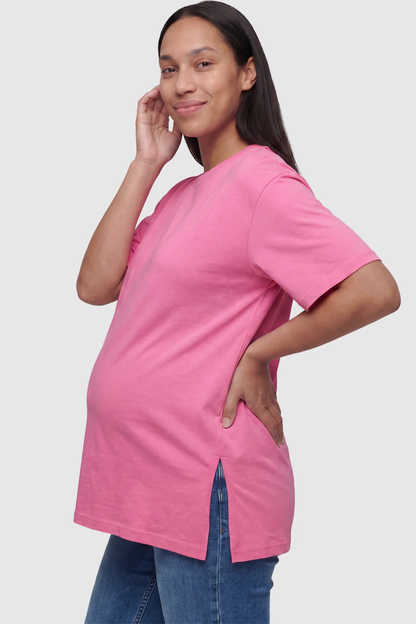 Basic One-Sided Slit Short Sleeve Maternity Top Basic one-sided slit short sleeve maternity top in rose red with one-sided slit, side view on pregnant model