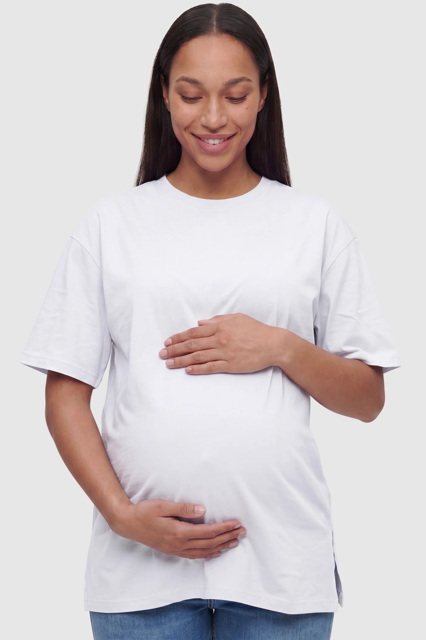 Basic One-Sided Slit Short Sleeve Maternity Top Basic one-sided slit short sleeve maternity top in white with classic round neckline, front view on pregnant model