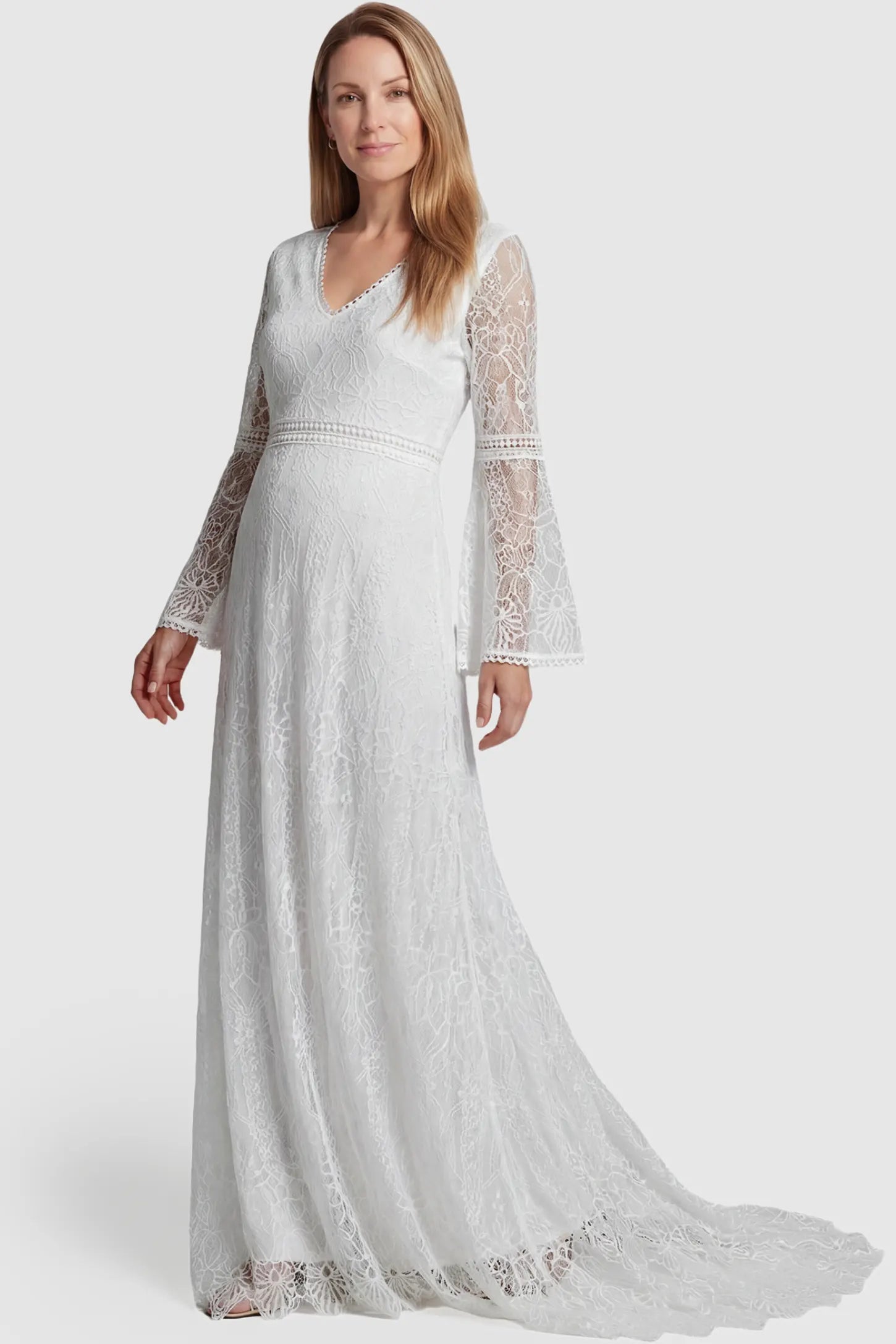 Lace Bell-Sleeve Bridal Maternity Gown Lace Bell Sleeve Bridal Maternity Gown in white featuring scalloped lace hem and flowy back train on a pregnant model.