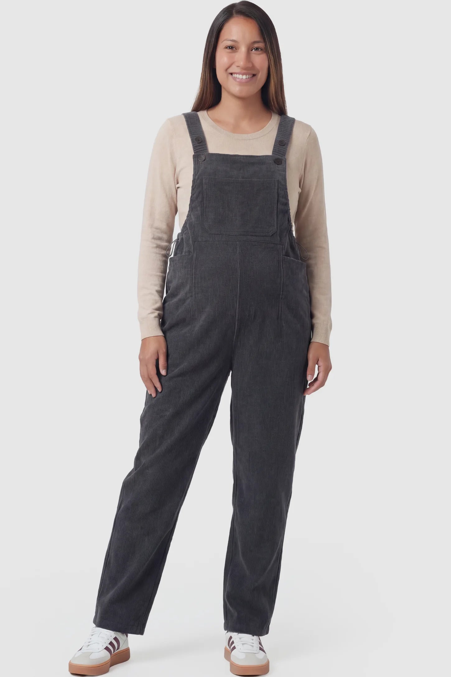 Corduroy adjustable-strap maternity overalls in gray with retro corduroy texture, front view on pregnant model