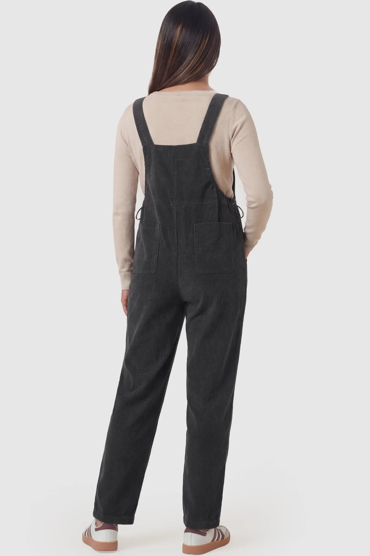 Corduroy Adjustable-Strap Maternity Overalls Corduroy adjustable-strap maternity overalls in gray with retro corduroy texture, back view on pregnant model
