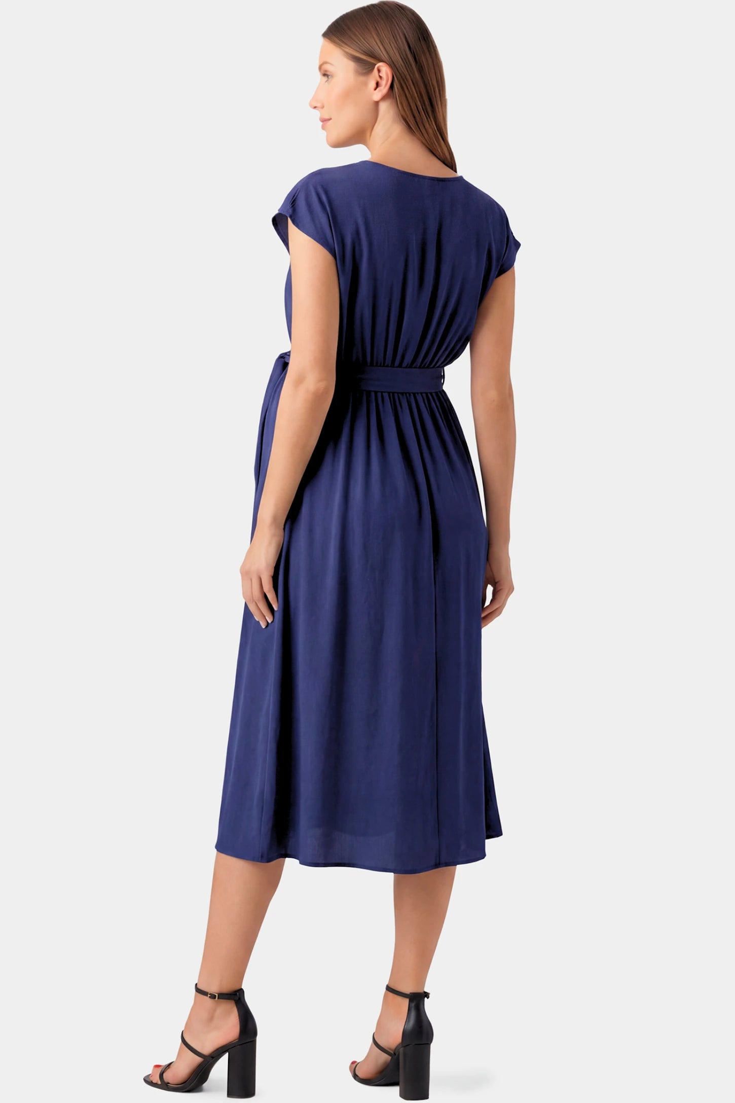 Cap Sleeves Belted Maternity Midi Dress Cap Sleeves Belted Maternity Midi Dress in blue featuring cap sleeves, and a self-tie waist belt on a pregnant model.