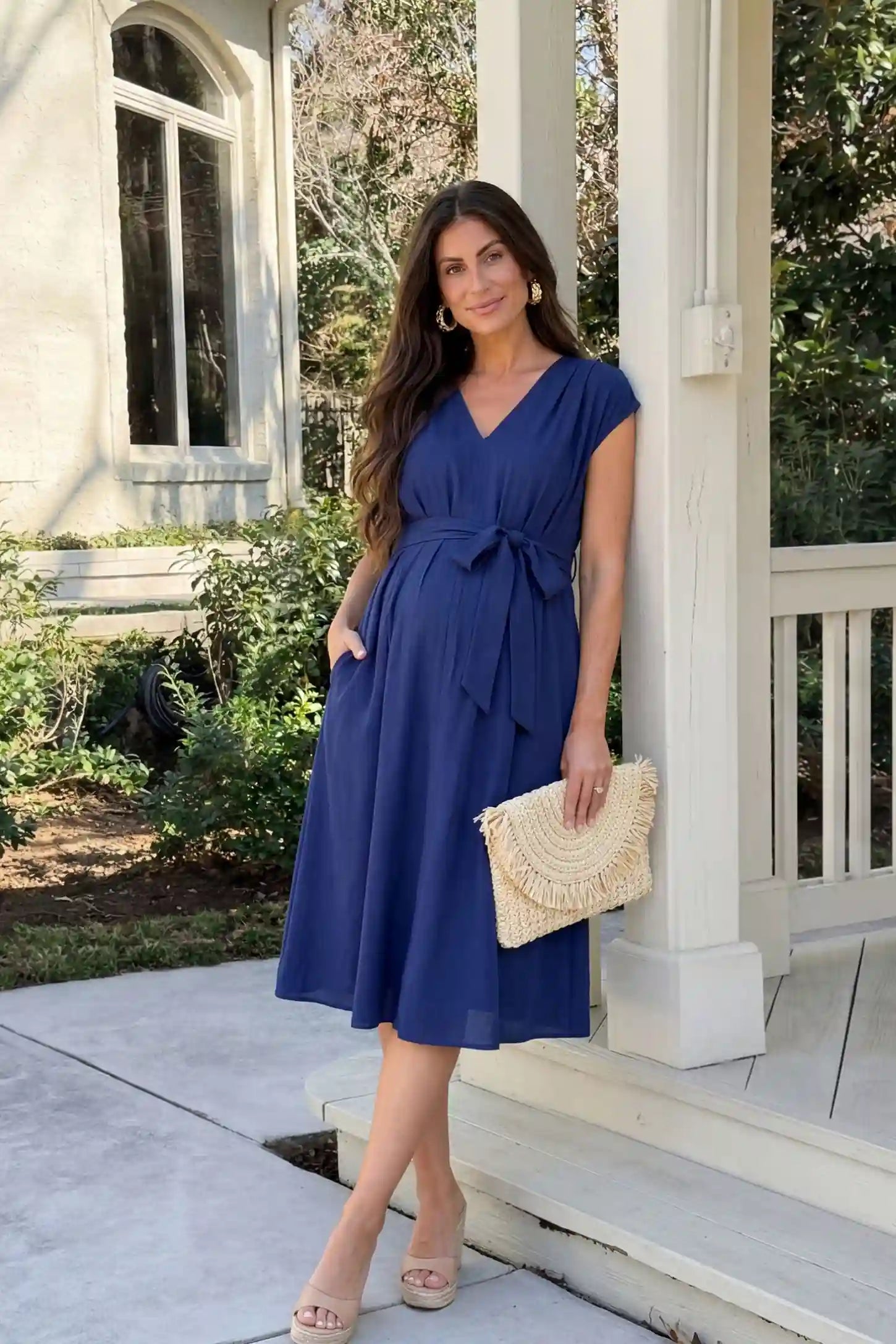 Cap Sleeves Belted Maternity Midi Dress Cap Sleeves Belted Maternity Midi Dress in blue featuring a V-neckline, cap sleeves, and a self-tie waist belt on a pregnant model.